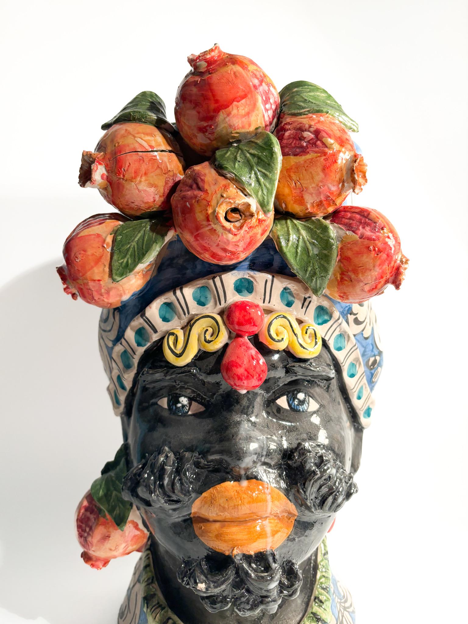 Moor's head of Caltagirone of a male figure with pomegranates, made by Ceramiche Germano in the 1990s

Ø 28 cm h 47 cm

Ceramiche Germano is a ceramic company based in Caltagirone, Sicily, Italy. The company was founded in 1967 by Sebastiano Germano