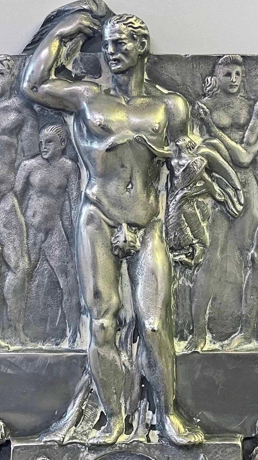 In the 1930s, when Italy was once again valorizing and idealizing the male nude -- witness the famous crescent of nude male athletes at the Foro Italico in Rome -- this silvered bronze panel was sculpted with a frieze of strong figures to honor a