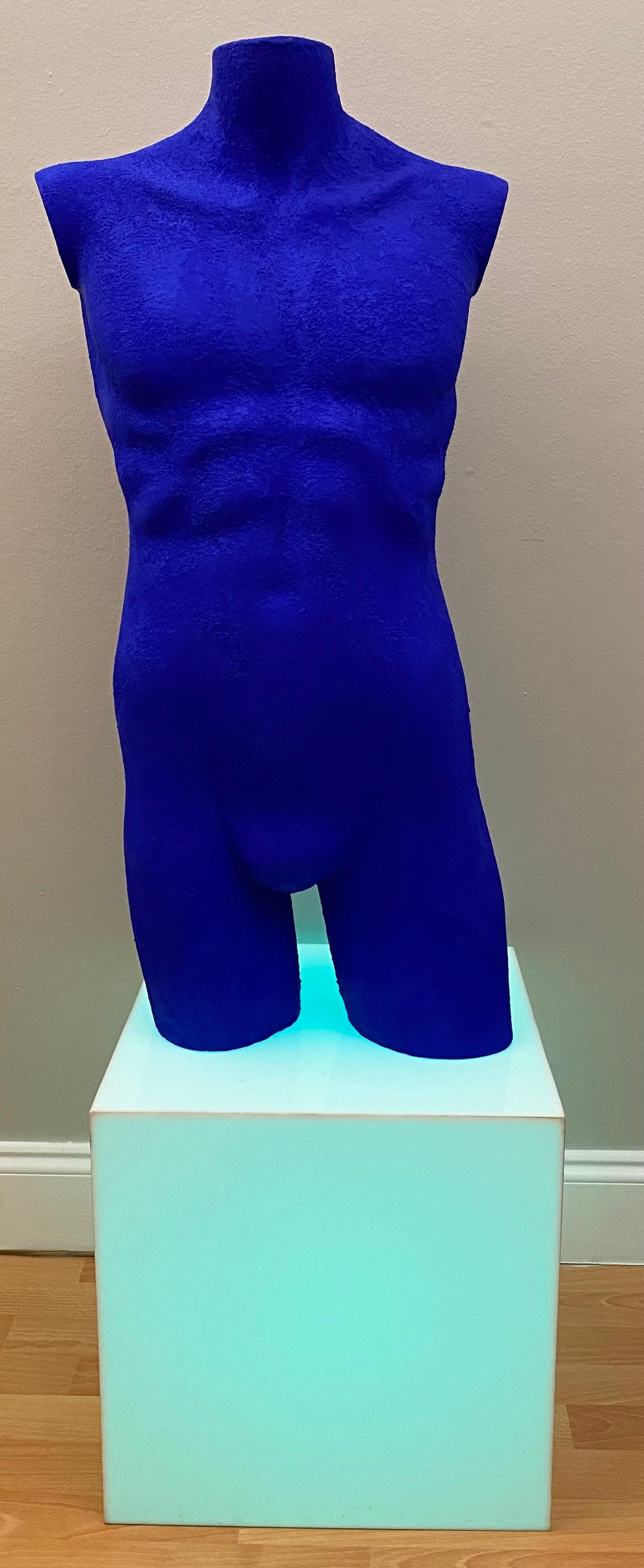 Modern nude male sculpture made of solid Lucite and finished in the manner of Yves Klein's blue pieces of art. This particular shade of blue, called IKB (International Klein Blue), was developed and patented by Klein himself.

This figurative