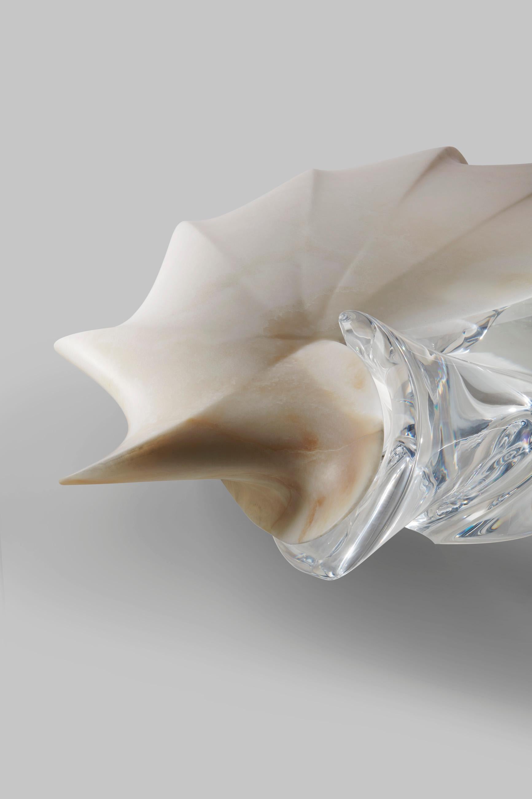 Designed by Zaha Hadid in Onice Ivory honed marble and polished plexiglass,  created for the Malea Collection, in a limited edition of 12 with 2 other designs. 

Combining two interlocking elements carved from a block of onyx. Malea represents a