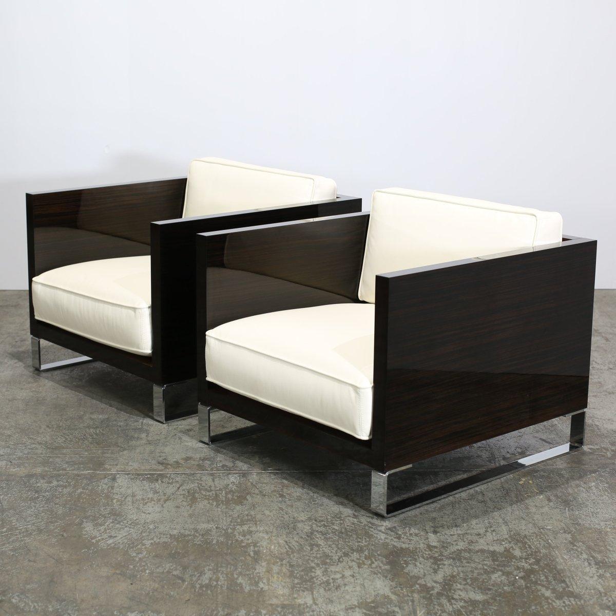 Introducing the Loveletter Armchairs by Malerba. These armchairs boast a sleek and elegant design, crafted with high quality materials. The plush cushioning provides ultimate comfort, while the glossy finish on the arms add a touch of