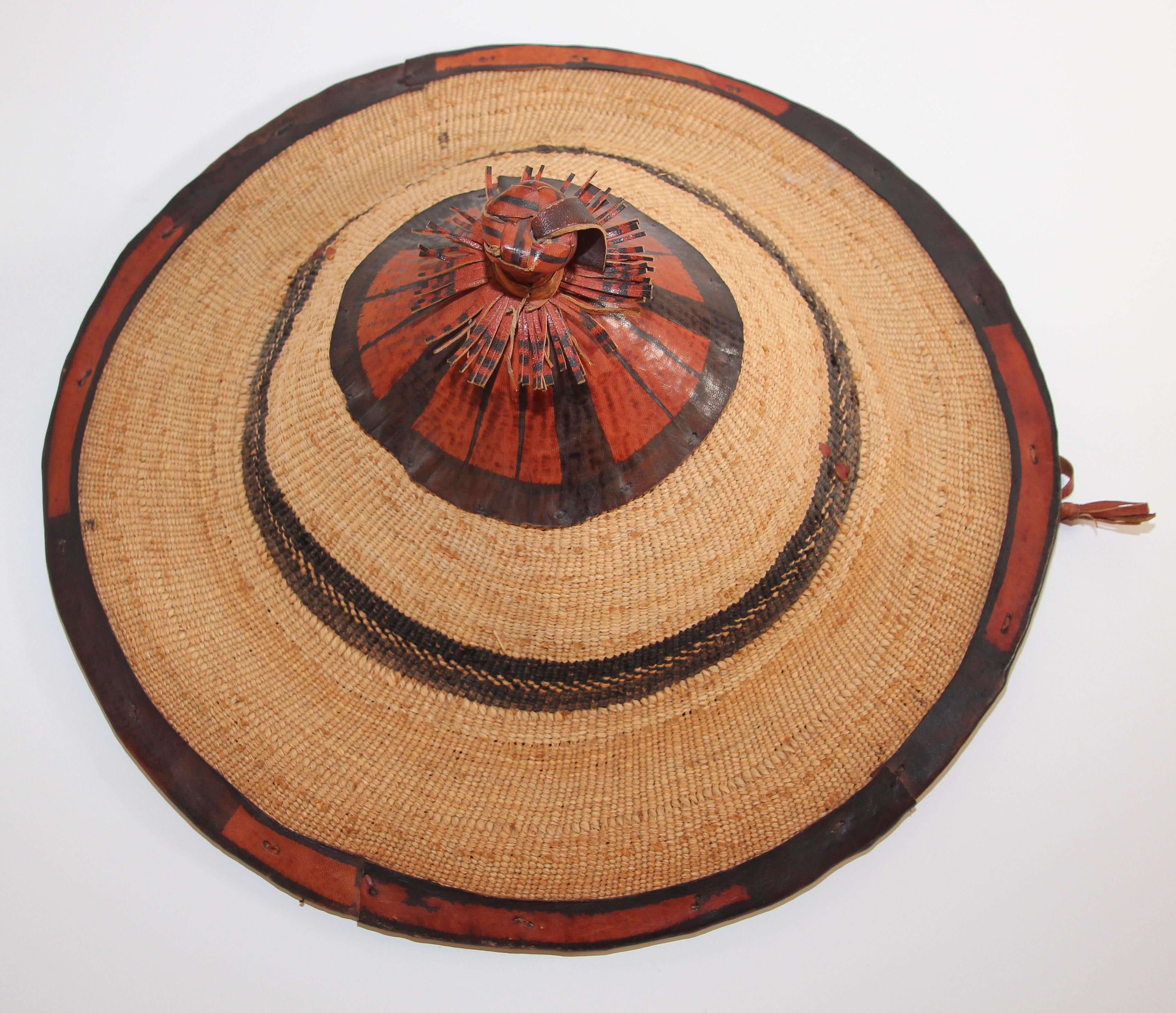 Large conical leather and straw tribal Fulani hat, Mali West Africa
Fiber hat with leather applications that comes from the Fulani people in West Africa.
It is typically worn by the Wodaabe, a nomadic cattle-herder subgroup of the Fulani.
It is