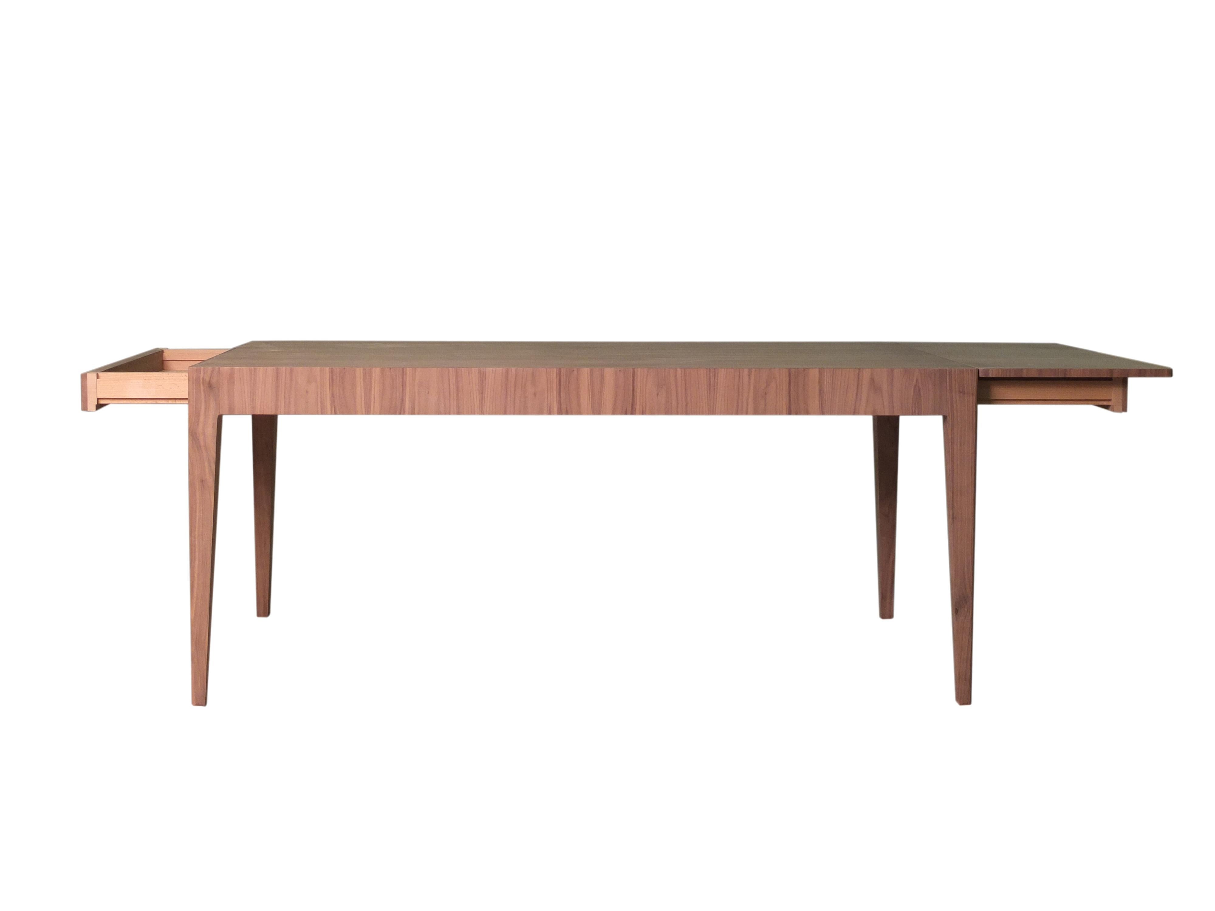Contemporary style Malibù dining table made of ashwood, or Canaletto walnut wood with two extensions of 45 cm
dimension when open 270 x 90 H 77 cm.
Customizable in different wood finishes on ash
Made in Italy by Morelato
 