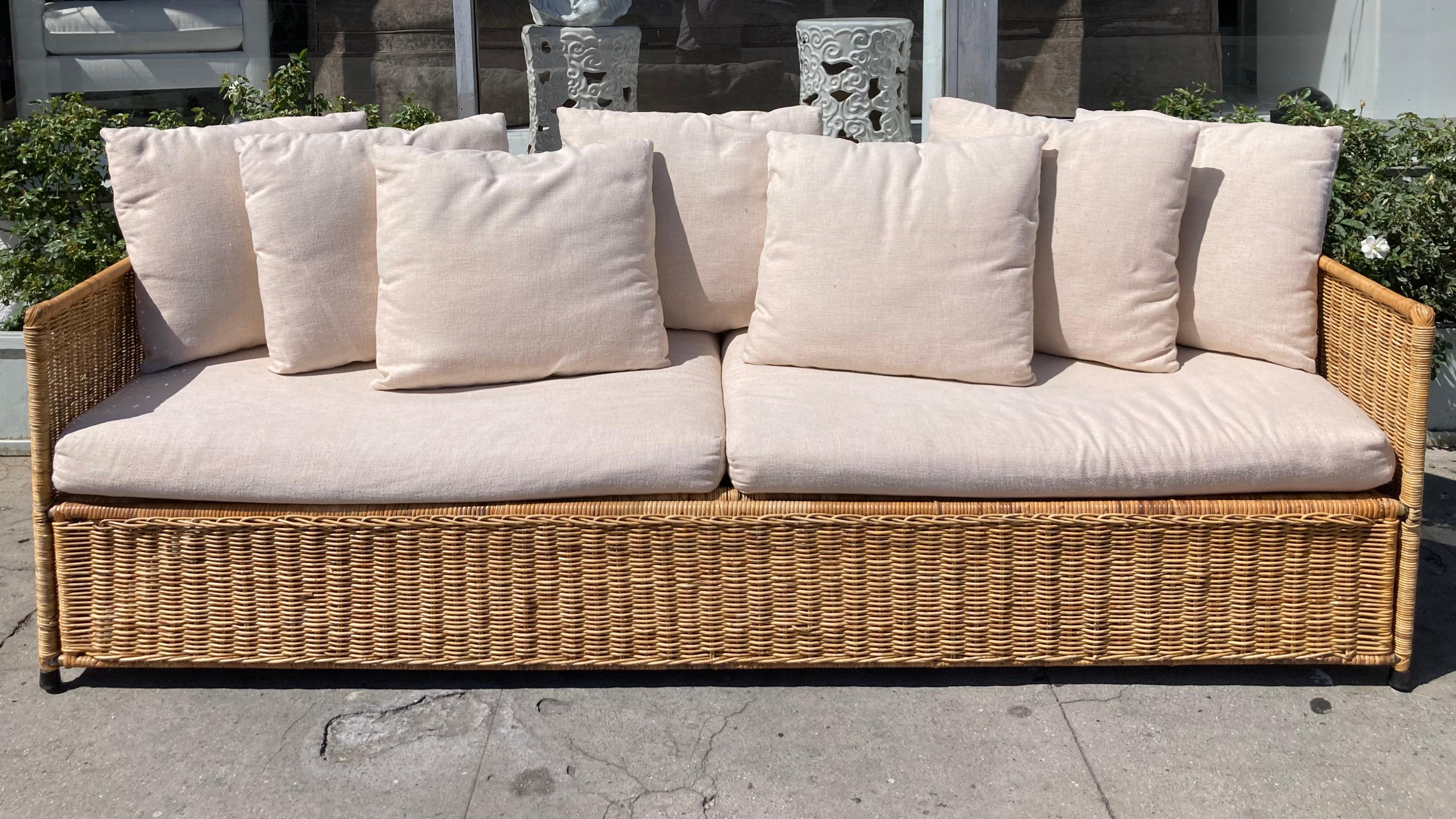 Gorgeous Malibu Italian wicker vintage sofa from the 1970s. Beautiful modern wicker design with simple square details. Love the combination of natural wicker and natural linen upholstery and is in very good condition for its age.