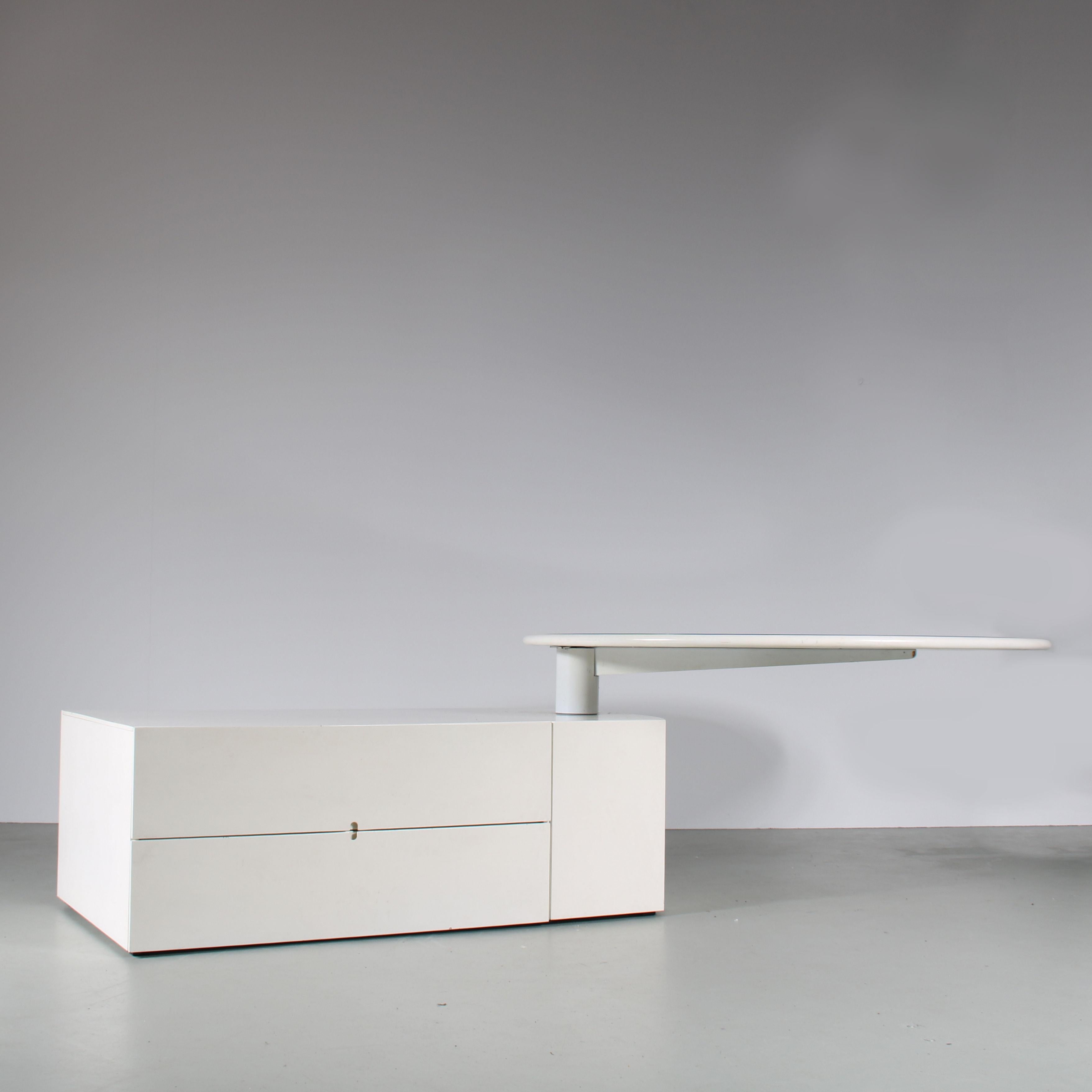 A beautiful dining table, model “Malibu”, designed by Cini Boeri and manufactured by Arflex in Italy around 1980.

This outstanding piece has a white wooden base with storage unit and adjustable round top. It has two drawers that open and close
