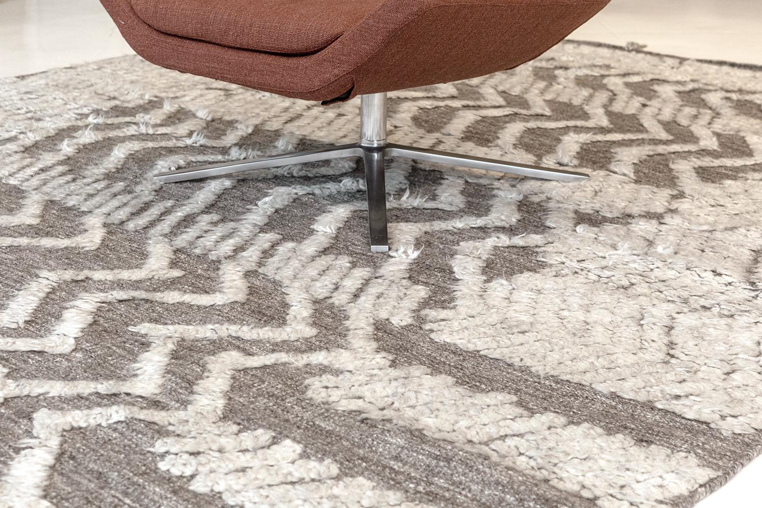 Malibu is a breathtaking rug in our Zig Zig Zag collection that features myriads of lines forming zigzag motifs in an artistic manner. Overlaying in a plush gray field, this rug gives a space a charming and inviting feel. Every element of the piece,