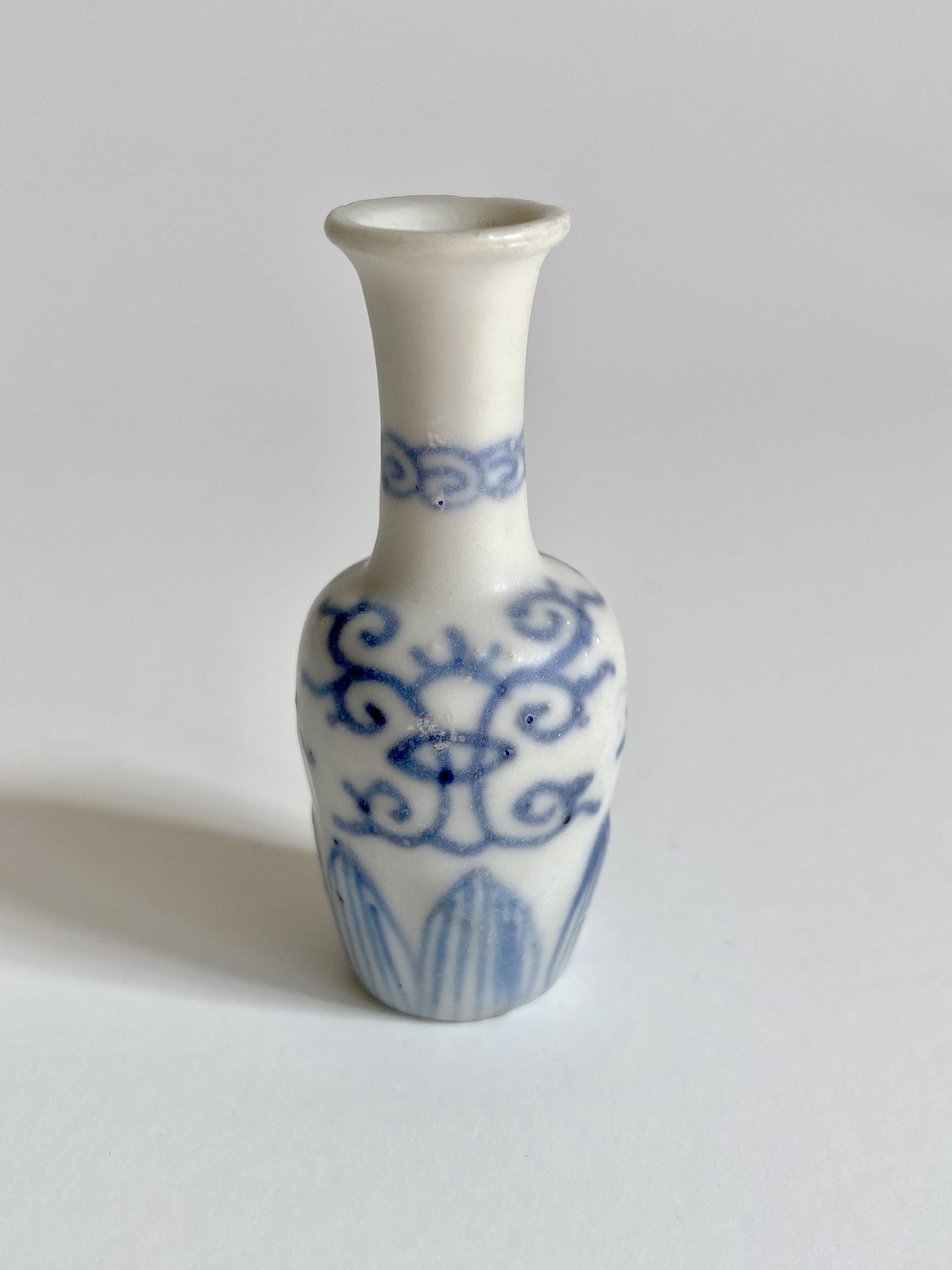 Miniature 17th century blue and white mallet-shaped vase. 

This miniature vase was part of a hoard recovered by Captain Michael Hatcher from the wreck of a ship that sunk in the South China sea in approximately 1643. Approximately 25,000 pieces