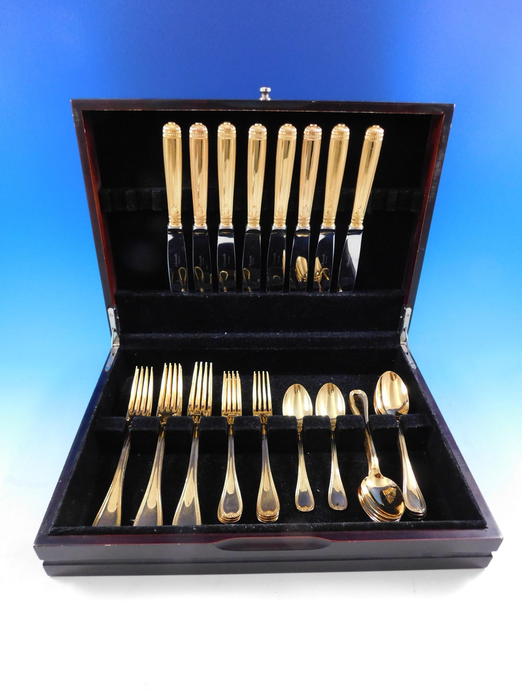 Gorgeous dinner size Malmaison by Christofle Silverplate Gilded (completely gold-washed) Flatware set - 40 pieces. This set includes:

8 dinner knives, 9 5/8