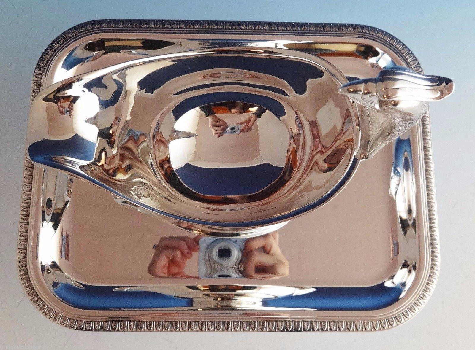 Malmaison by Christofle
Malmaison by Christofle silver plated gravy boat and underplate. The gravy boat features an eagle head handle. New, never used. It includes Christofle box with pouch. The underplate measures 10 1/4 x 8 . The pieces are not