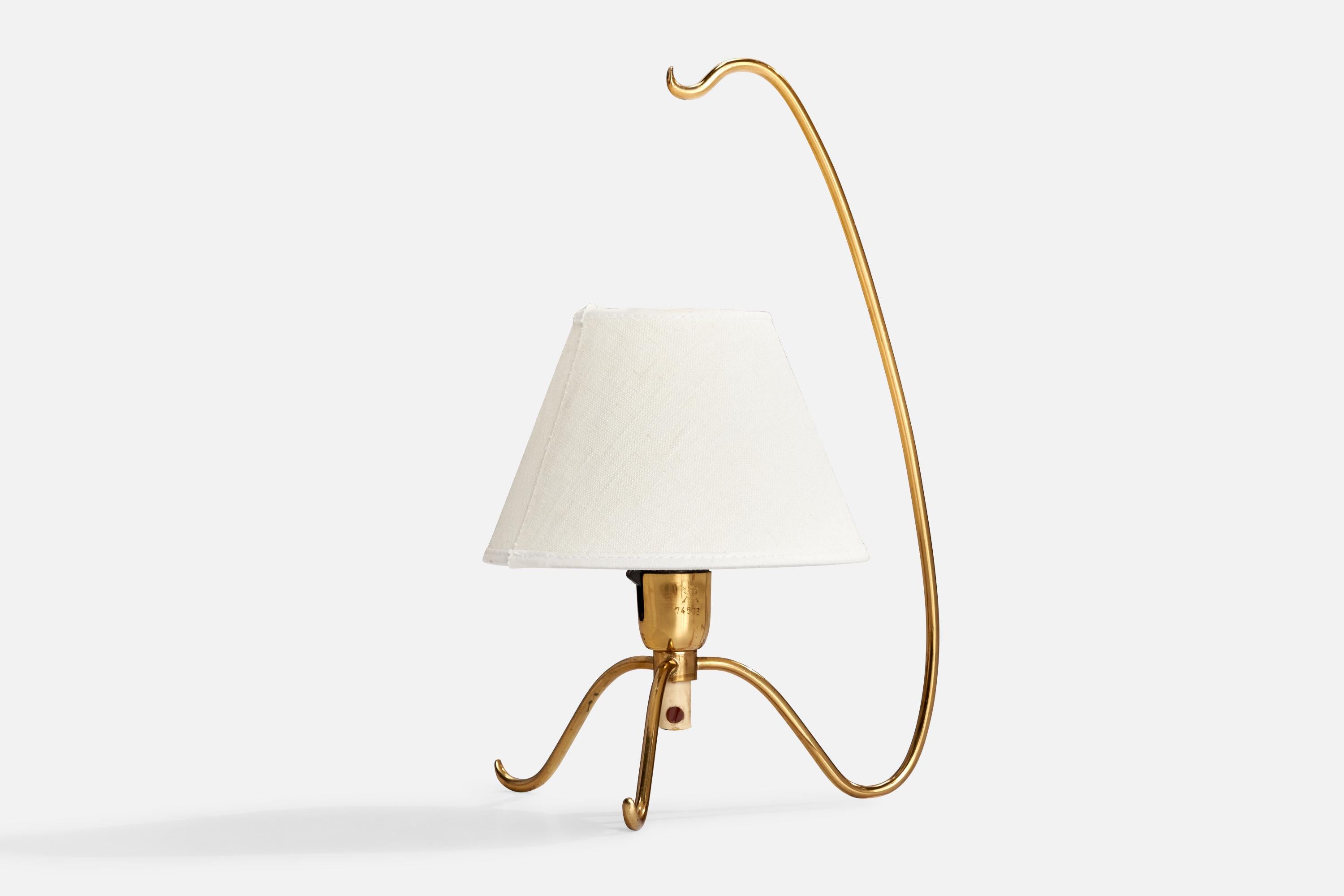 A brass and white fabric table lamp produced by Malmö Metallvarufabrik, Sweden, 1940s.

Overall Dimensions (inches): 13” H x 7” W x 8” D
Stated dimensions include shade.
Bulb Specifications: E-14 Bulb
Number of Sockets: 1
All lighting will be