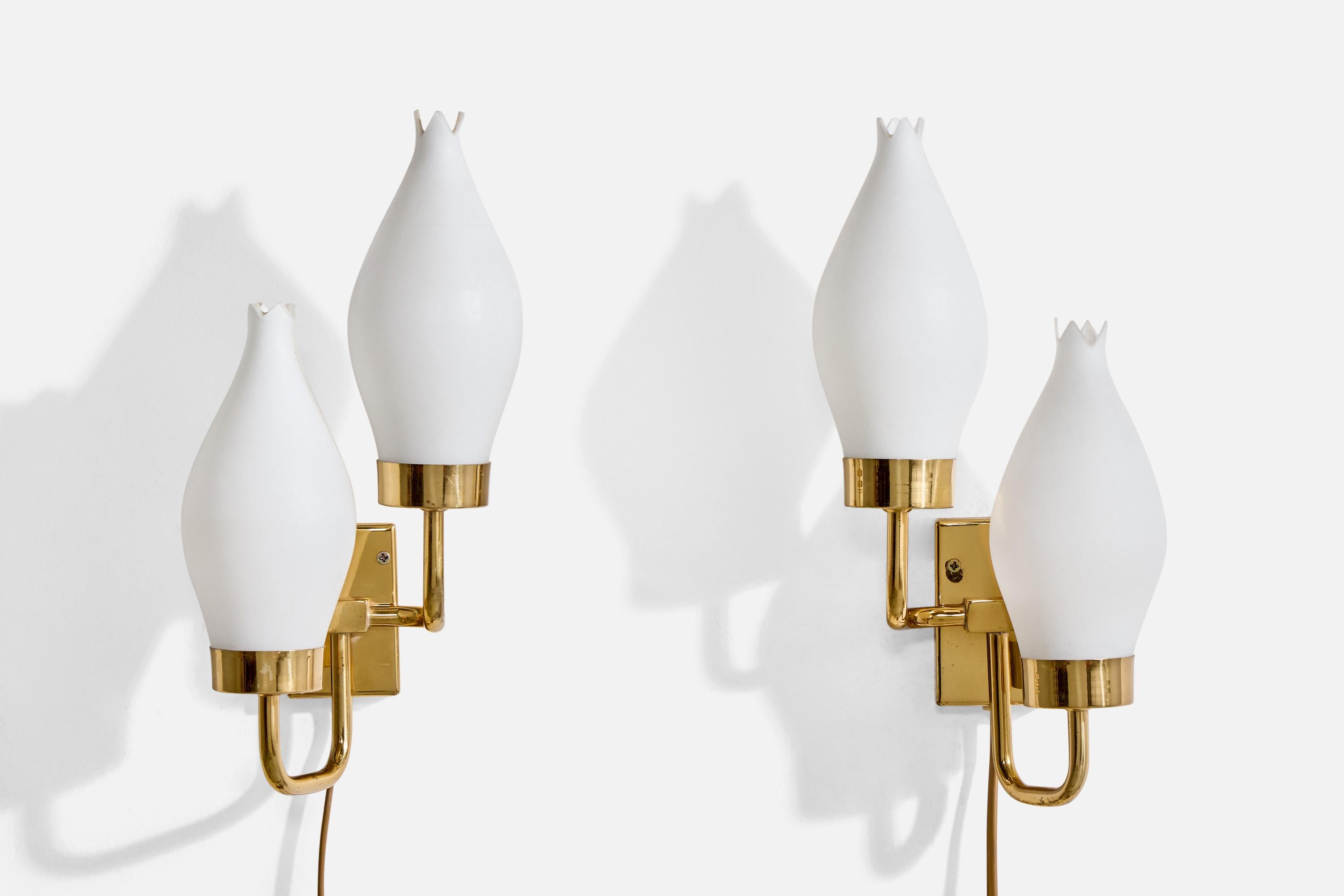 A pair of brass and white opaline glass wall lights designed and produced in Sweden, c. 1950s.

Overall Dimensions (inches): 12.25” H x 6.125” W x 4.375” D

Back Plate Dimensions (Inches): 3.125” H x 2.125” W x .75” D

Bulb Specifications: