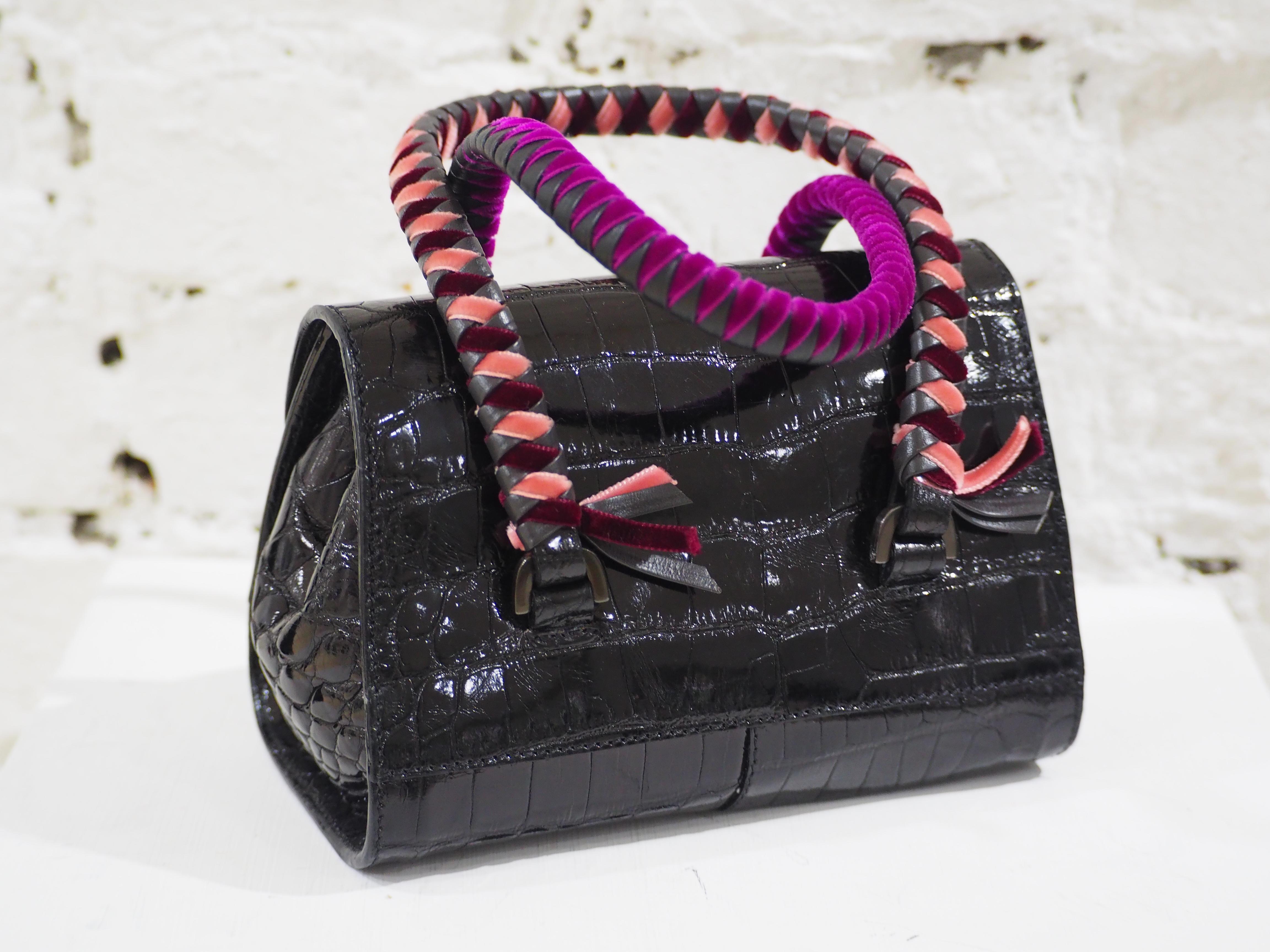 Malo black cocco and velvet mini handbag
vintage malo mini handbag embellished with bicoloured handles