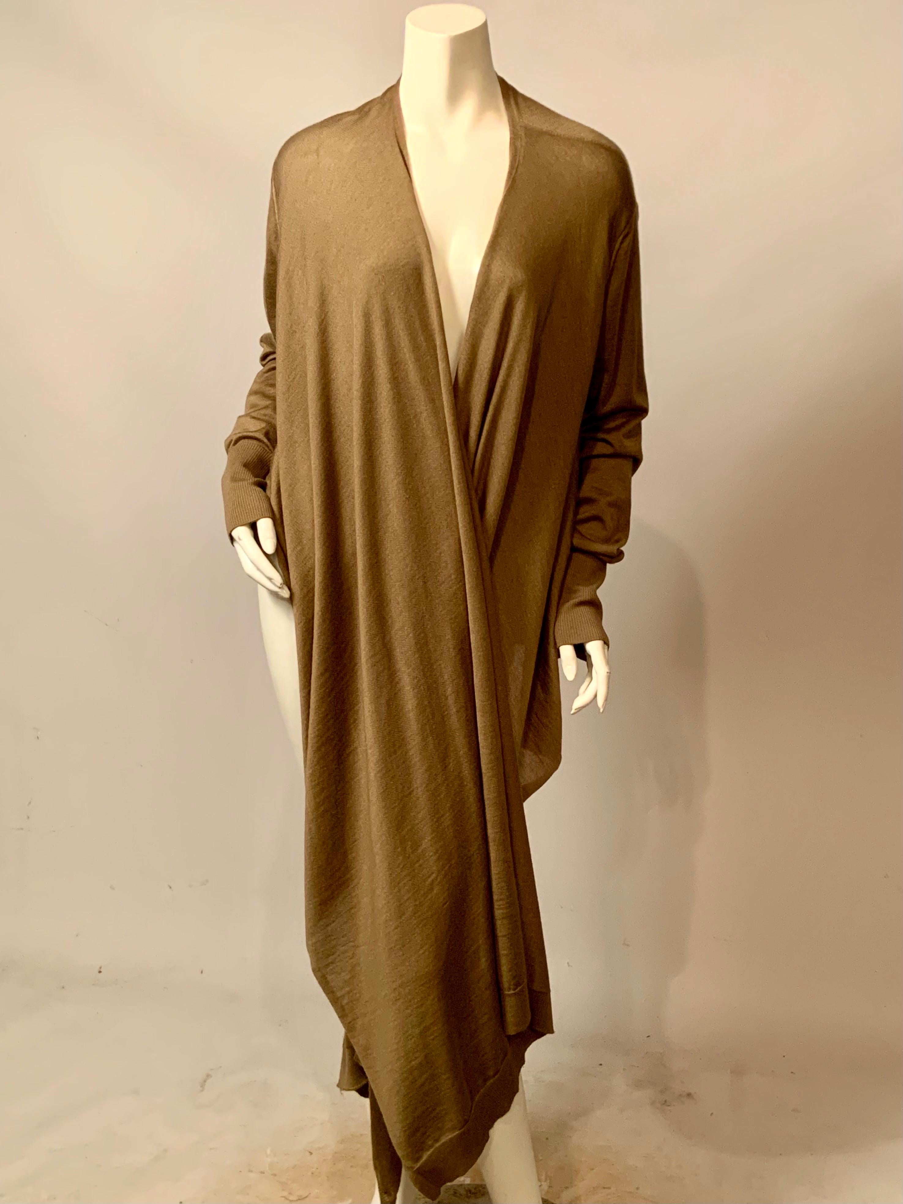 This cashmere and silk blend wrap sweater from Italian design firm MALO is a fabulous example of their innovative designs in luxury cashmere sweaters.  This sweater is a light weight blend of 70% cashmere and 30% silk and it has an interesting