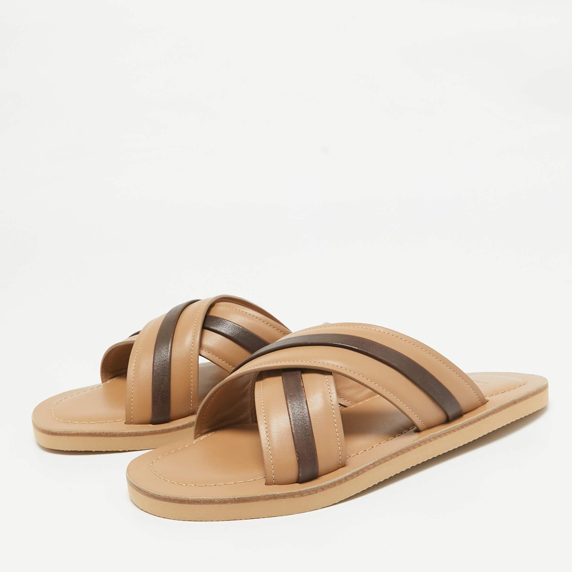 Enhance your casual looks with a touch of high style with these designer slides. Rendered in quality material with a lovely hue adorning its expanse this pair is a must have