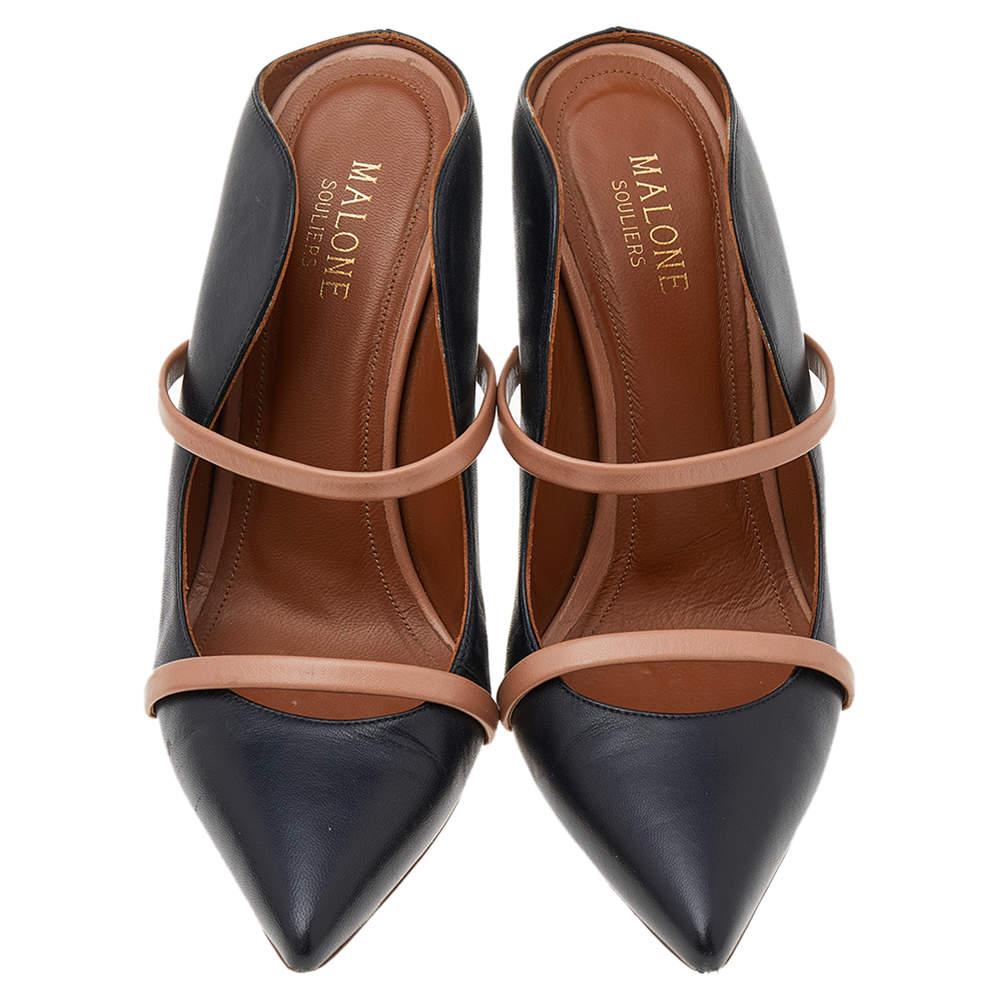The Maureen sandals by Malone Souliers have been designed creatively to exude nothing but excellence! The black leather construction brings to life a pointed-toe silhouette and the dual straps across the vamps add a refined touch. Comfortable