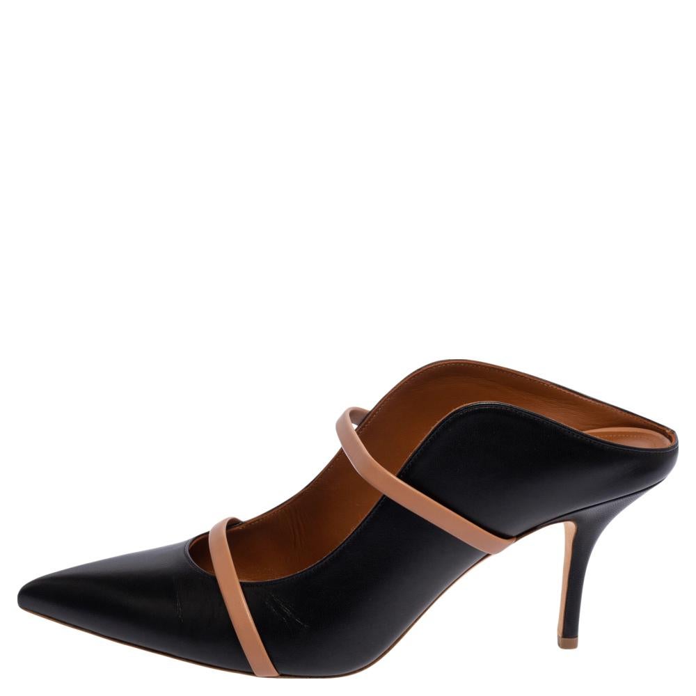 These iconic Maureen mules are not only graceful and chic but also highly comfortable. Crafted from leather in a black hue, the straps highlight the shape of your feet. The pointed-toe silhouette completes these stunning mules so that you can flaunt