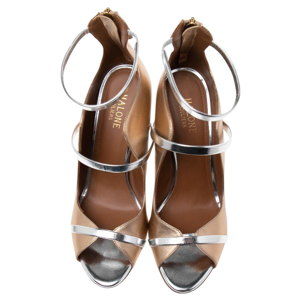 Carved in a flattering silhouette with a fancy exterior, these sandals from Malone Souliers never fail to make an impression. These Mika sandals are created using gold leather with a Triple Band detail adorning their upper. A zipper is situated on