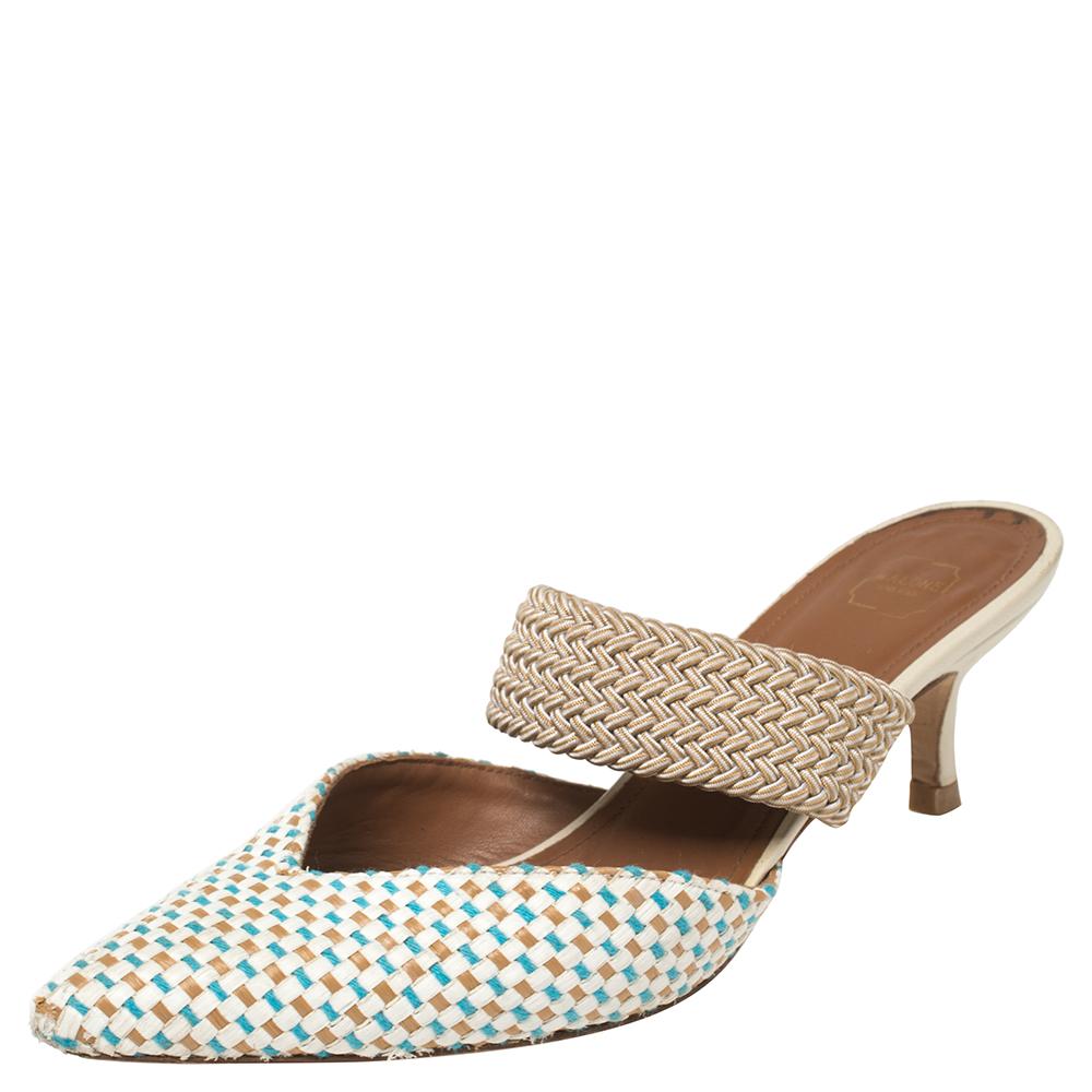 The sharp pointed-toe silhouette of Malone Souliers’ Maisie mules lends them a bold yet feminine tone. They are made from woven raffia feature a braided strap and sit on a kitten heel. Wear them with a simple midi dress for a casual lunch meeting.

