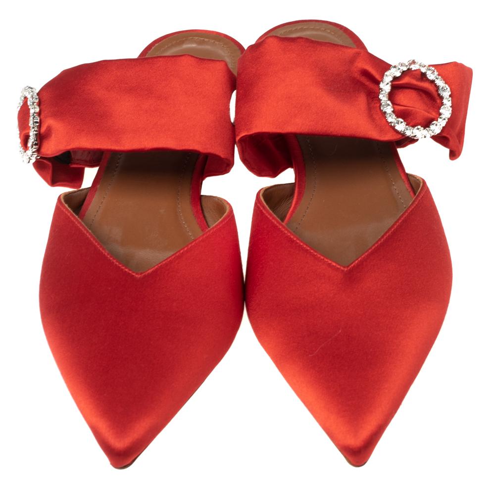 These Malone Souliers flats in red satin are a must-have in your footwear collection. They are designed in a pointed-toe style with crystal-embellished buckle detail on the uppers.

