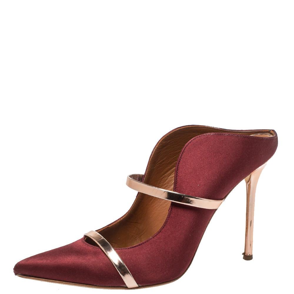 These iconic Maureen mules are not only elegant and feminine but also incredibly comfortable. Crafted from luxe satin in a burgundy shade, the curvy silhouette accentuates the shape of your feet, and the leather trims wrap them beautifully. The