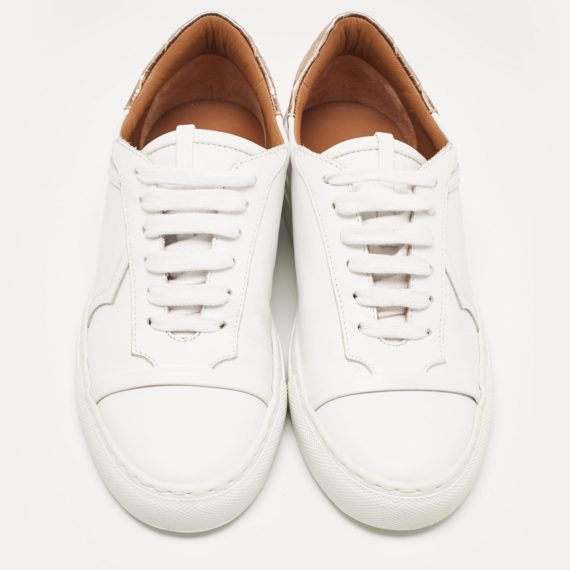 Coming in a classic silhouette, these Malone Souliers white sneakers are a seamless combination of luxury, comfort, and style. These sneakers are designed with signature details and comfortable insoles.

Includes: Original Dustbag, Original Box,