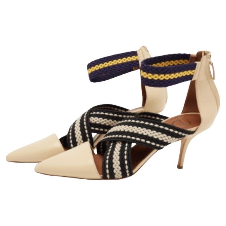 These Dana pumps from Malone Souliers x Roksanda will encourage you to take every step confidently and elegantly. They are made from beige leather and elastic, which is elevated with pointed toes, an ankle strap, and 8 cm heels. Flaunt your classy