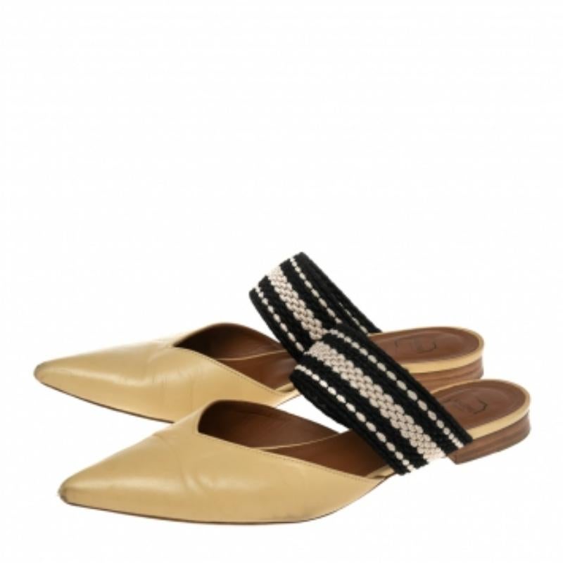 These mules are from Malone Souliers. They have been crafted from canvas and leather and feature pointed toes. They flaunt a single band across the vamps. The comfortable leather-lined insoles leave no stone unturned for you to make them yours!