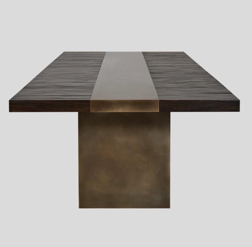 Malta dining table by Aguirre Design
Dimensions: L 304.8 x W 99-119.4 x H 29.5 cm
Materials: Dark stained split bamboo with matte finish and non directional medium
 Blackened Steel

Combining industrial edge with natural beauty, Malta is a