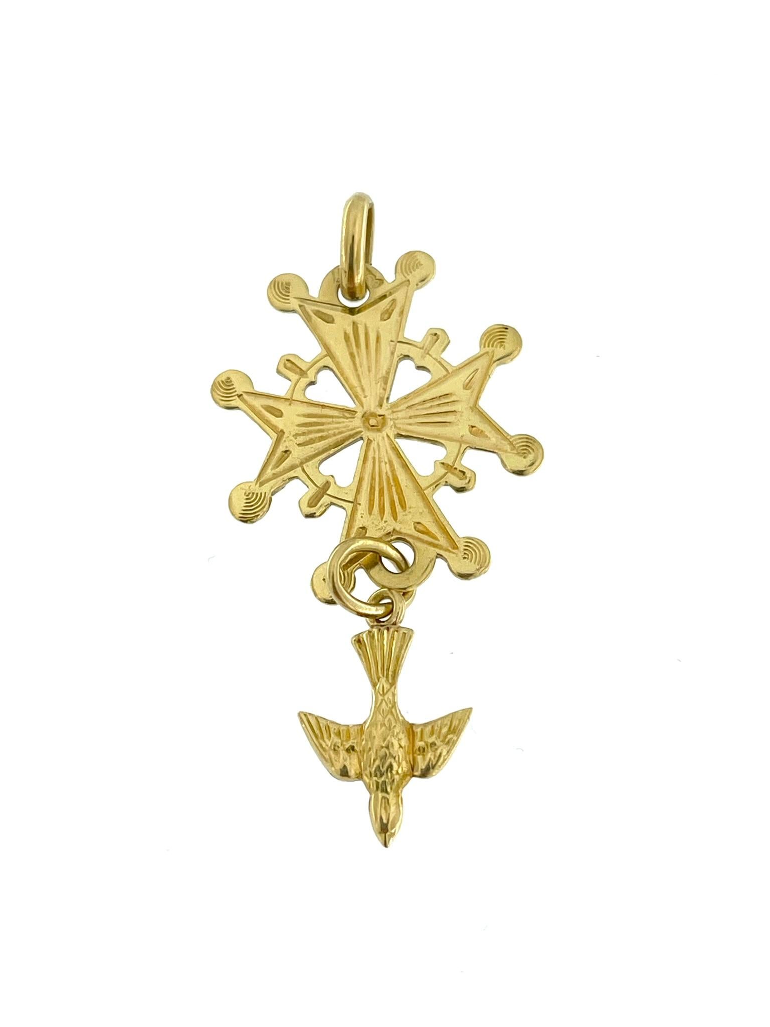 The Maltese Cross with Dove crafted in 18 karat Yellow Gold is an exquisite piece of jewelry characterized by its intricate relief work. The Maltese Cross, a symbol associated with various historical and cultural significances, is the focal point of
