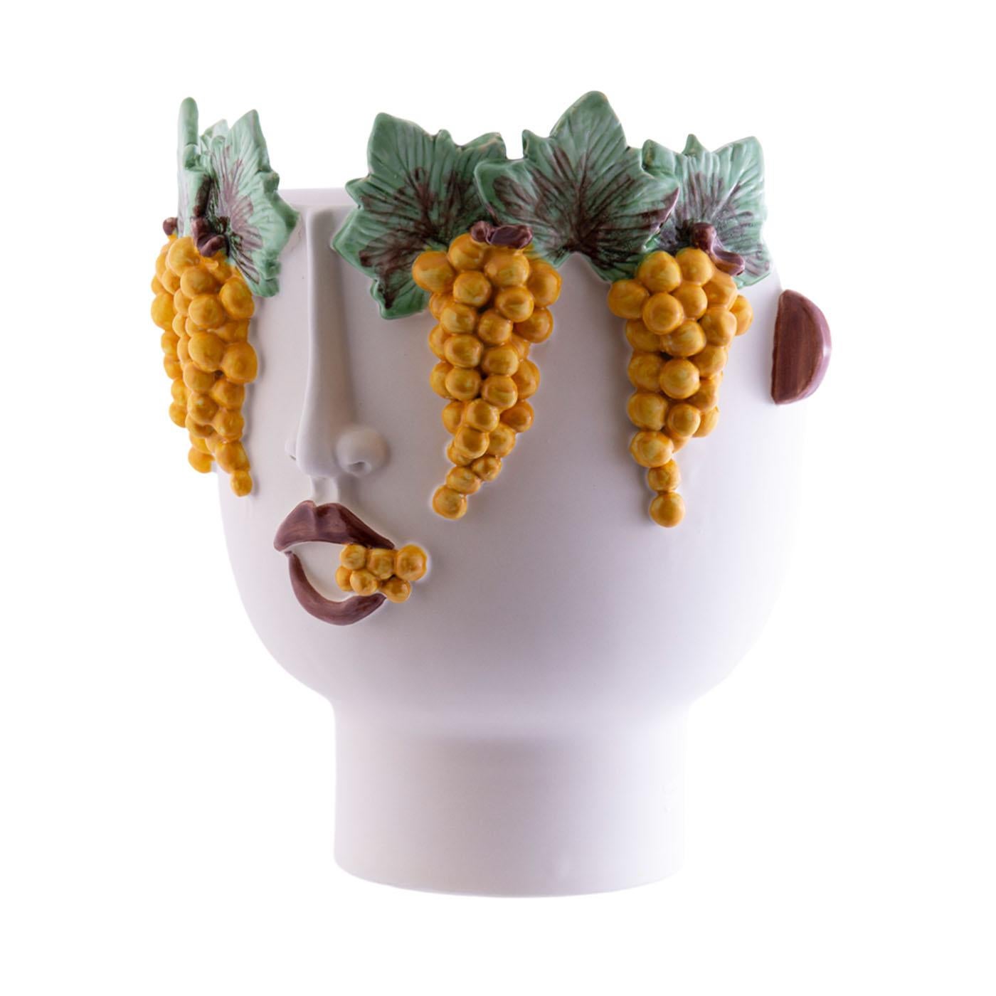 The second fire-fired ceramic head, handmade with face and white grapes reliefs, can be used to hold plants, flowers and sometimes even bottles with ice. Malvasia sells White grapes at the Palermo market, a beautiful and amazing woman!