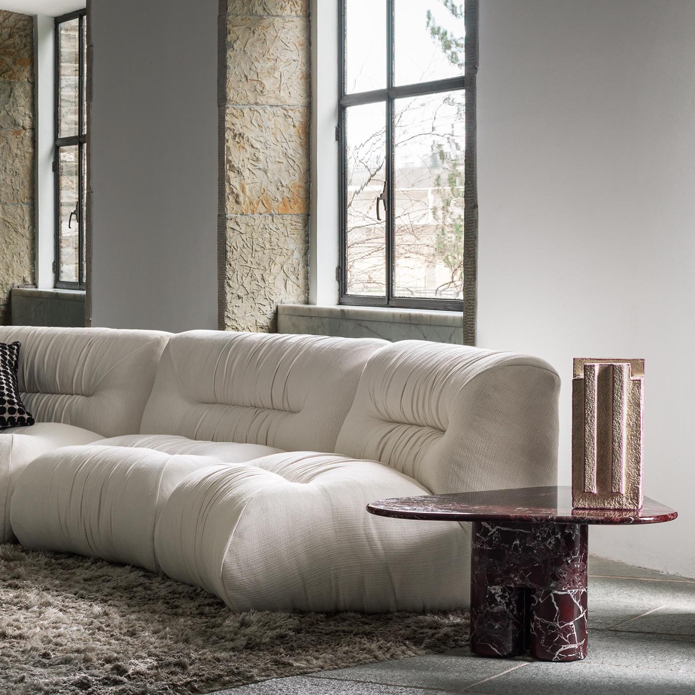 The Mambo modular sofa features a sinuous, flowing design inspired by the elegant movements of the mambo dance. This sofa is composed of multiple modules that harmoniously connect to form a dynamic seating arrangement. Its plush upholstery evokes
