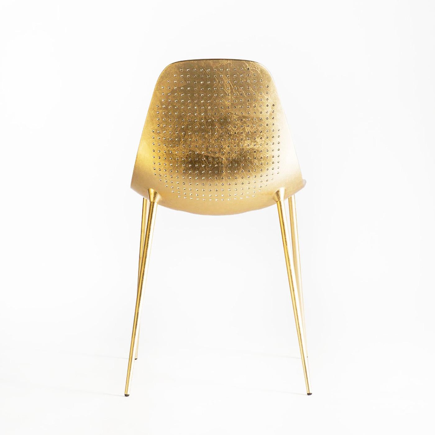 This striking chair has a structural skin in aluminum supported by a zinc-coated metal structure. The chair is hand-finished with 24-karat gold leaf and 398 Swarovski elements hand-applied to give a unique texture to its outside surface.