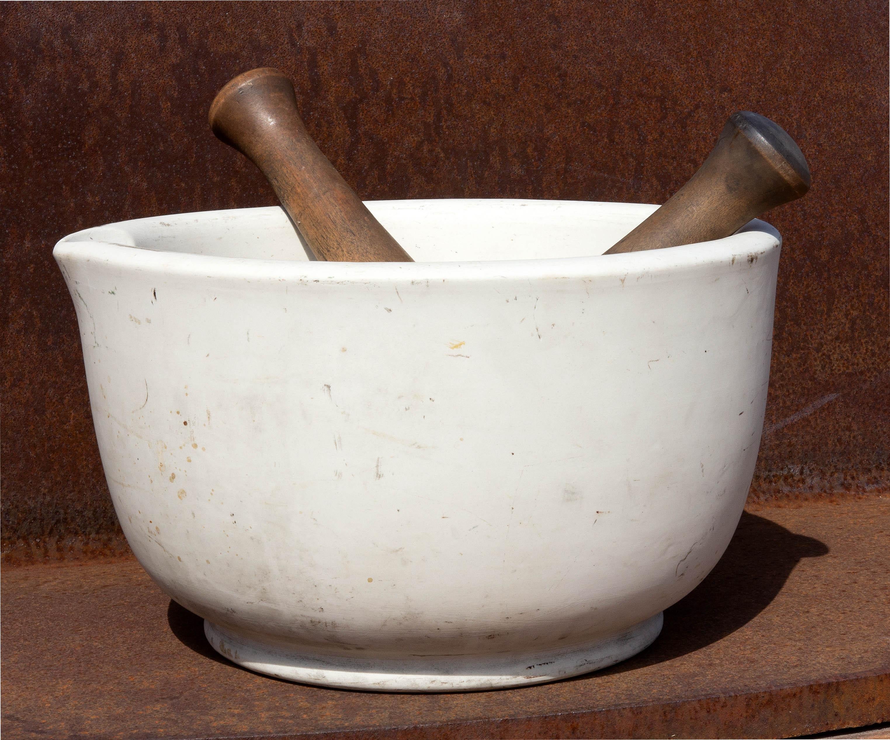 Mammoth porcelain mortar and pestle. Great for cooks or as an accent piece. . Heavy duty. Mortar weighs over 25 lbs. 14.75