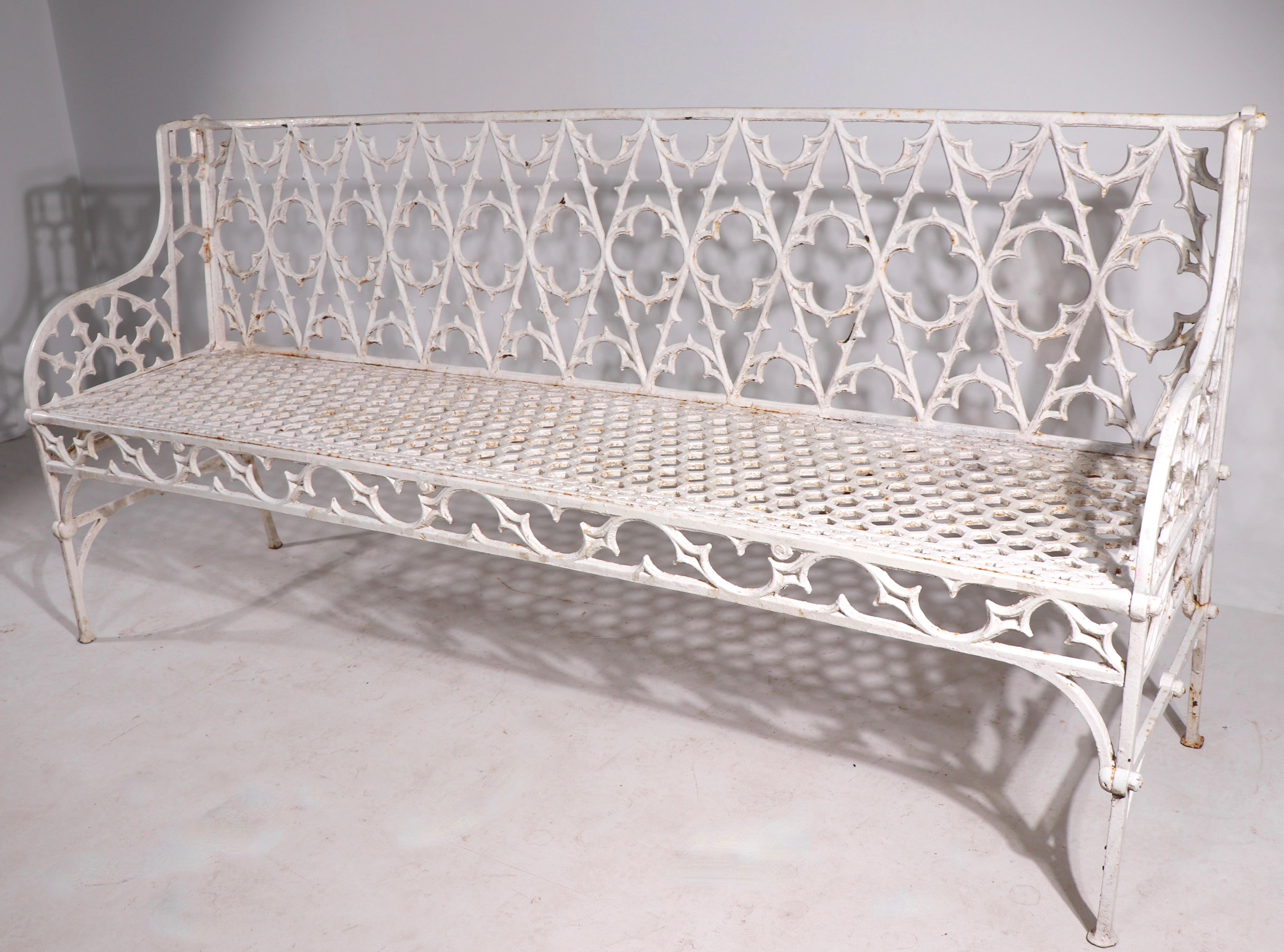 Large scale cast iron bench attributed to English maker Coalbrookedale, unsigned. This example is in very fine, original condition, free of breaks, or repairs. Highly unusual to find this size, this bench may have been a custom or special order