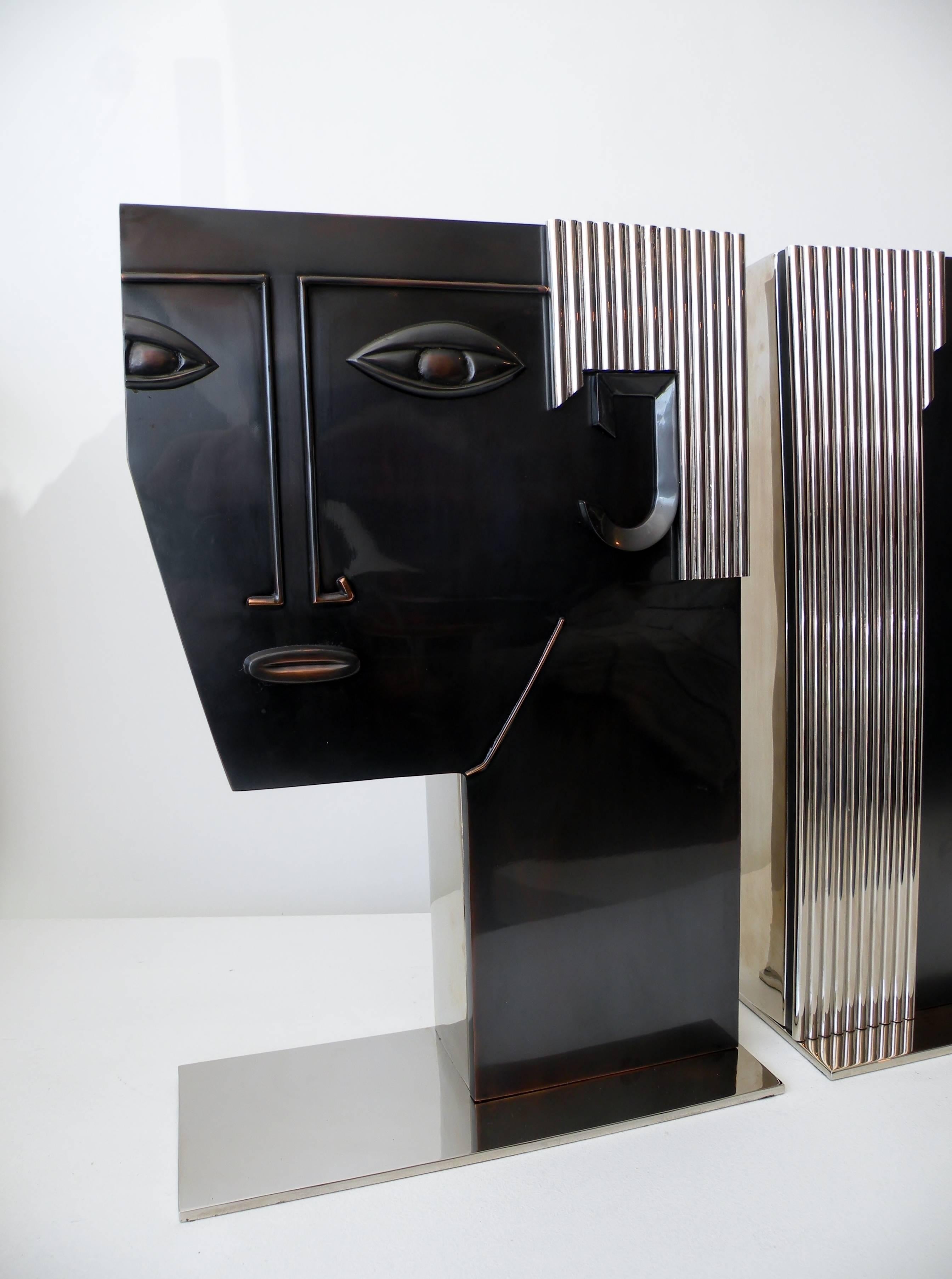 Large-scale pair of Art Deco face vases of a man and woman inspired by similar pieces by Franz Hagenauer. Fine quality manufacture, all metal construction, heavy in the hand, unmarked and date to the 1980s.