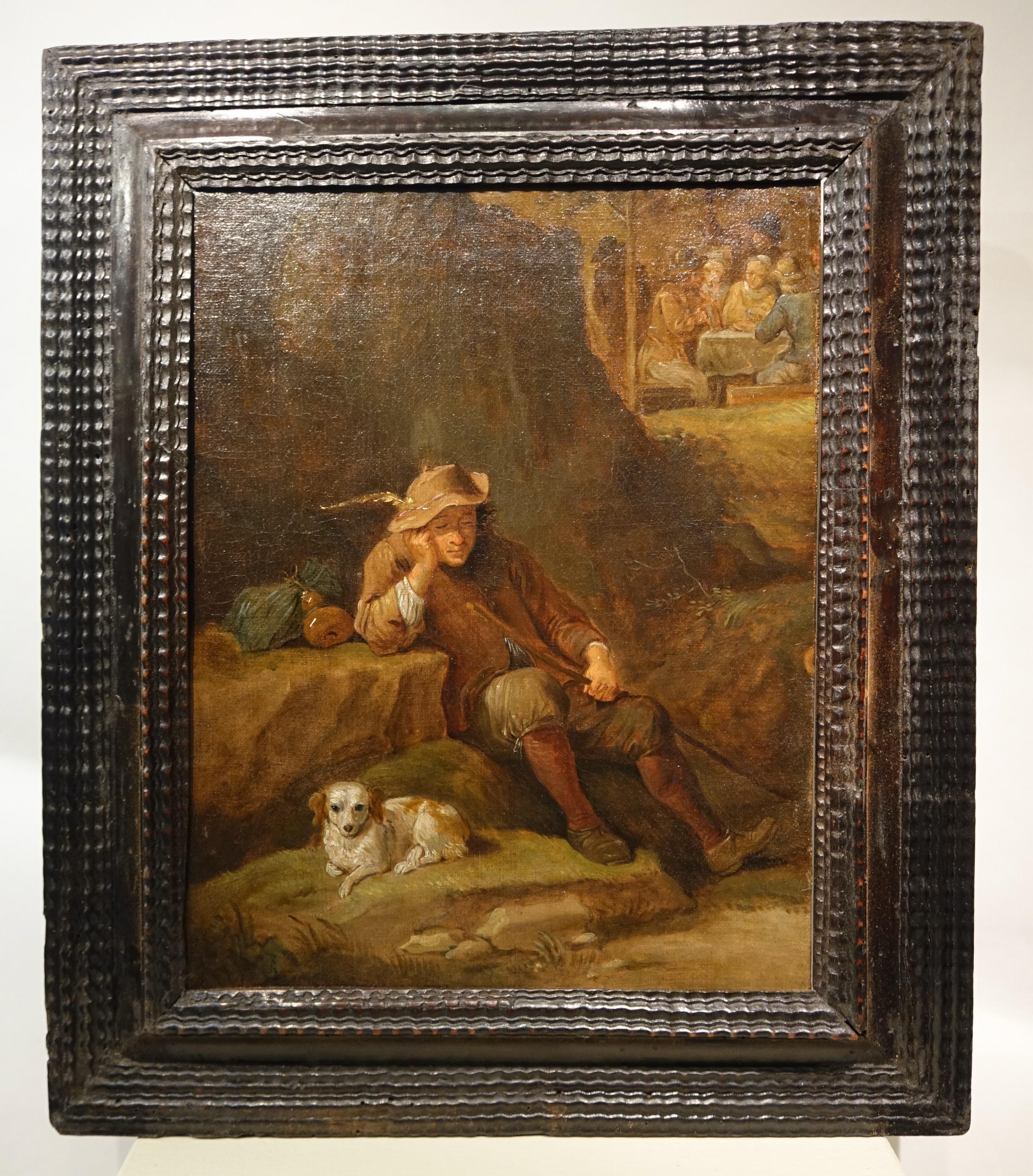 Oil on canvas portraying a dozing man, seated, leaning against a rock, his dog looking at the viewer in the foreground. 
In the background a group sitting at a table under an awning.
Formerly attributed to David Teniers the younger (1610-1690)
Black