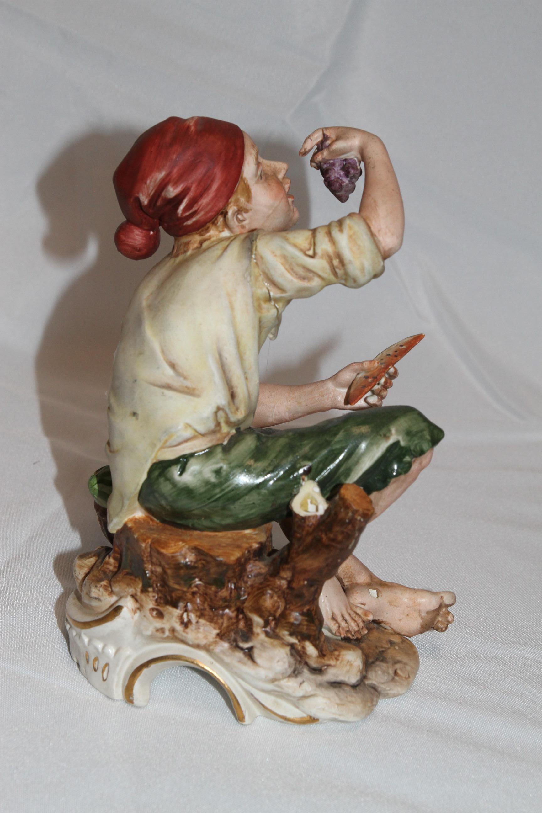Americano Scultura di uomo che mangia uva e anguria in vendita