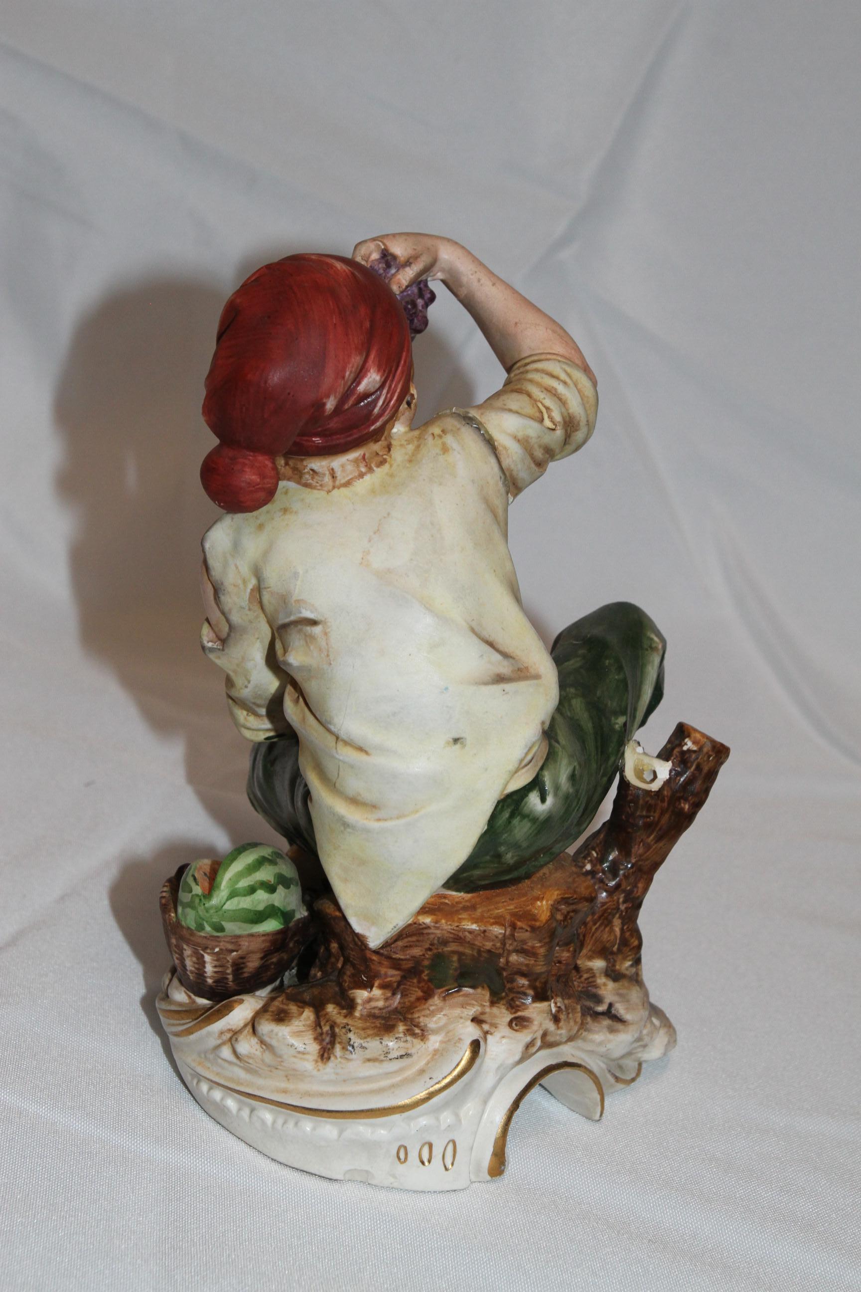 XX secolo Scultura di uomo che mangia uva e anguria in vendita