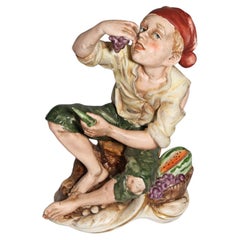 Vintage Man eating grapes and watermelon sculpture