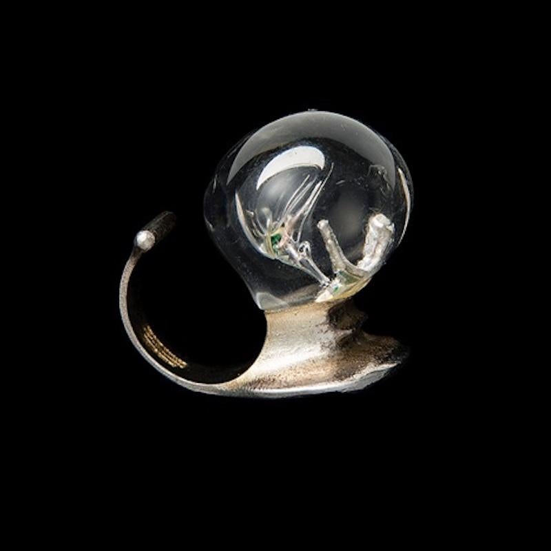 Original ring by Björn Weckström. 

The shank is made of sterling silver and would best fit a ring size 7,5 / 8. However, due to the design of the ring, it would be comfortable worn by anyone, on any finger (except maybe the smallest). 
The head is