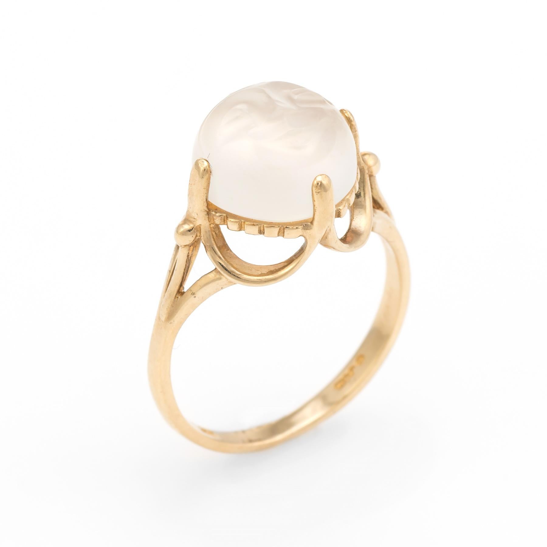 Striking Man in the Moon ring (circa 1960s to 1970s), crafted in 10 karat yellow gold. 

Centrally mounted iridescent carved moonstone face measures 10mm. The moonstone is in excellent condition and free of cracks or chips.   

The matching earrings