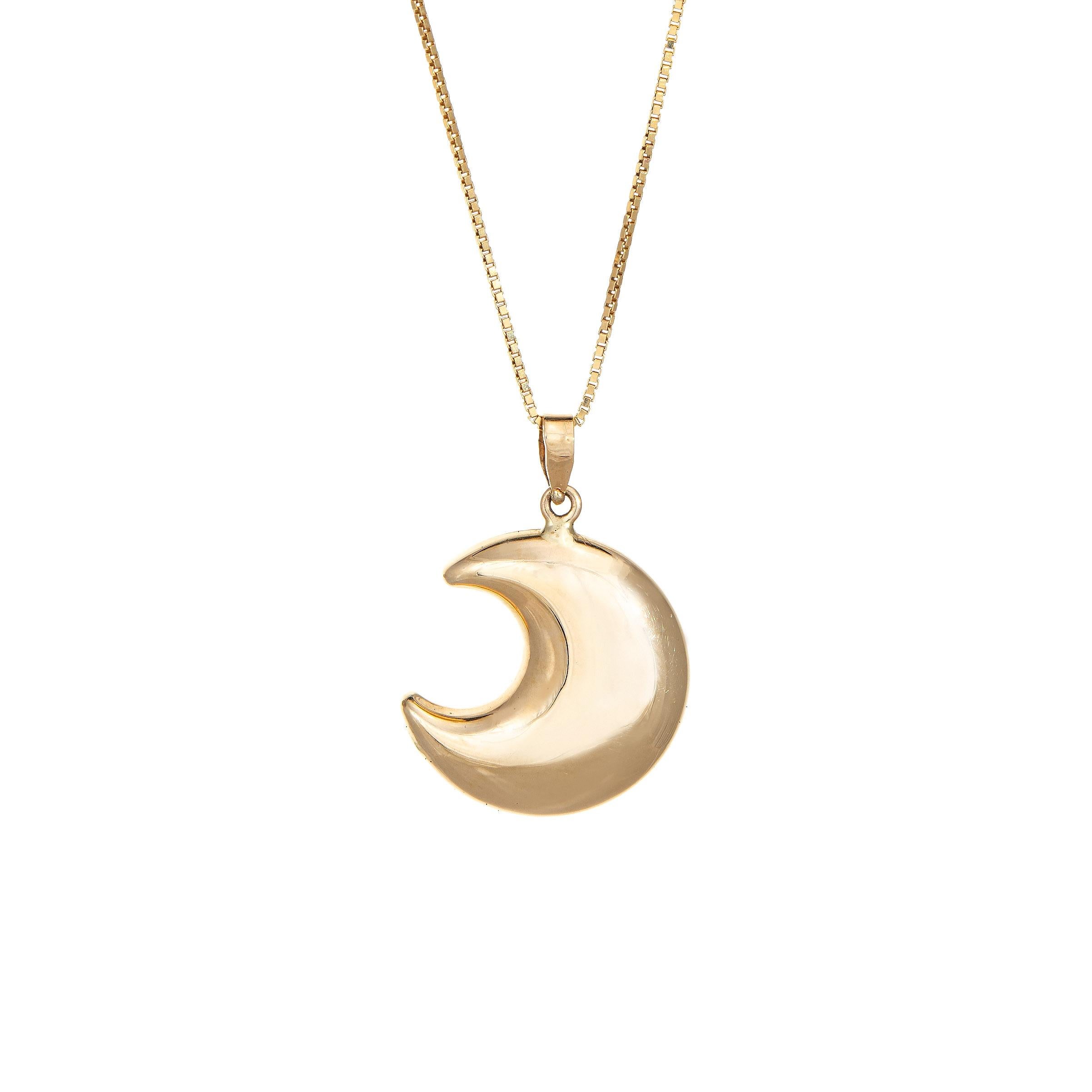 Stylish and finely detailed Man in the Moon necklace crafted in 14 karat yellow gold.  

The ever popular 'Man in the Moon motif is highlighted in the pendant, the face embossed into a cut out moon. The pendant comes with a fine box link 18k yellow