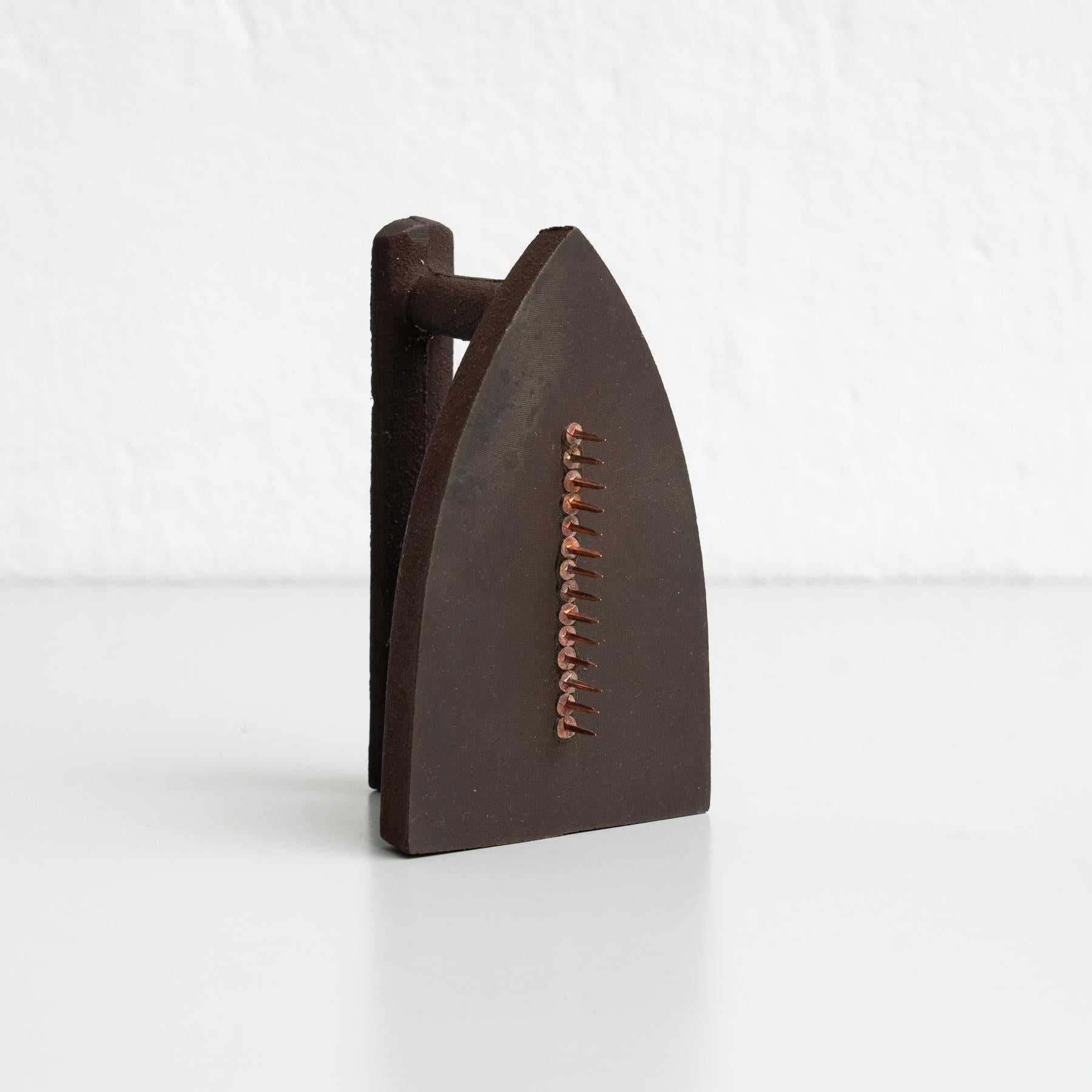 Own an iconic piece of surrealist art with Man Ray's Le Cadeau, a striking sculpture produced in 1974 in Italy. This limited-edition work is numbered 125/5000 and signed by the artist, making it a highly collectible and rare item.

Accompanied by