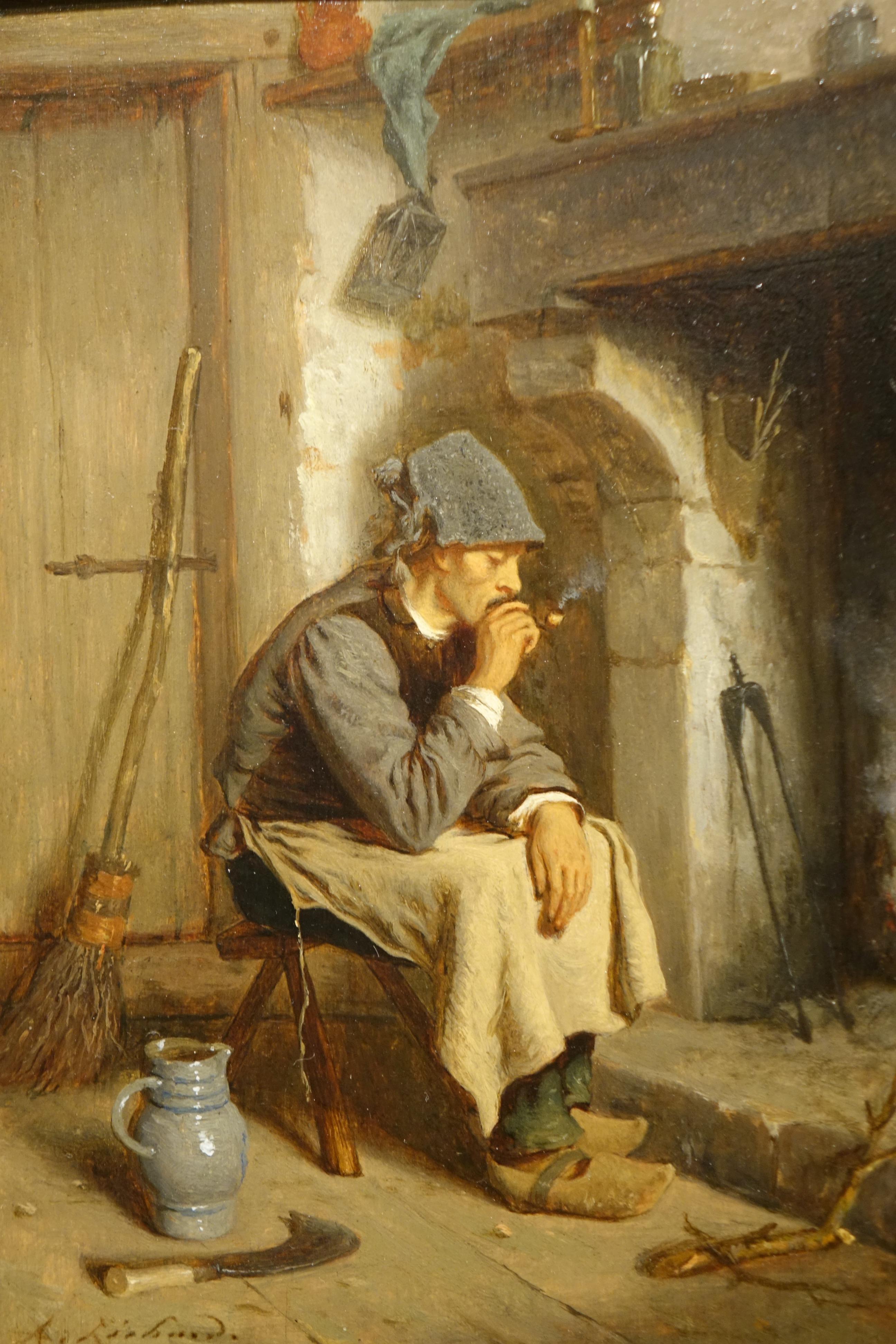 Man resting, sitting, smoking his pipe in front of the fireplace