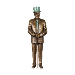 Uomo con cappello a cilindro Statuetta da tavolo in bronzo con patina d'oro e Verdigris