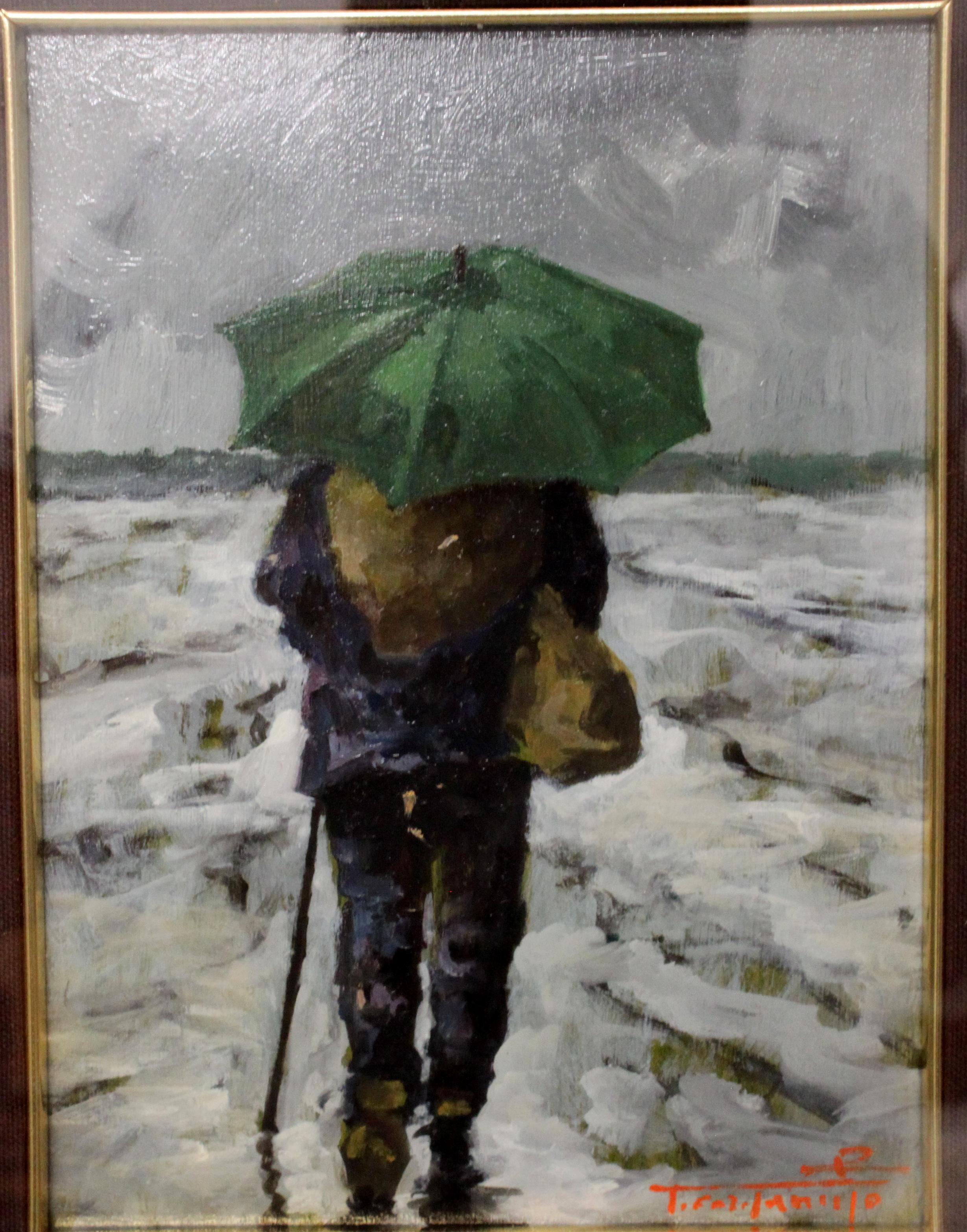 man with umbrella painting