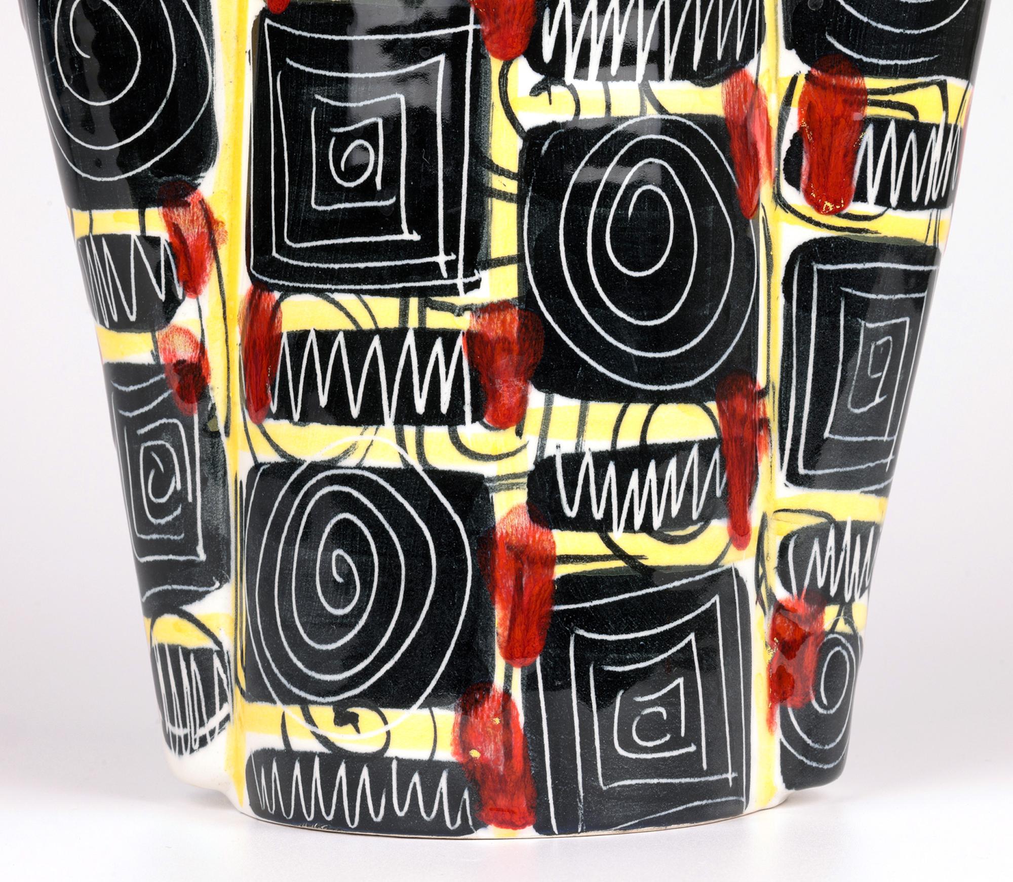 A typically stylish mid-century Italian art pottery ceramic vase by the Mancioli Pottery and dating from around 1960. The hand-crafted pottery vase of tripartite construction stands on a flat round unglazed base. The body is of tall cylindrical