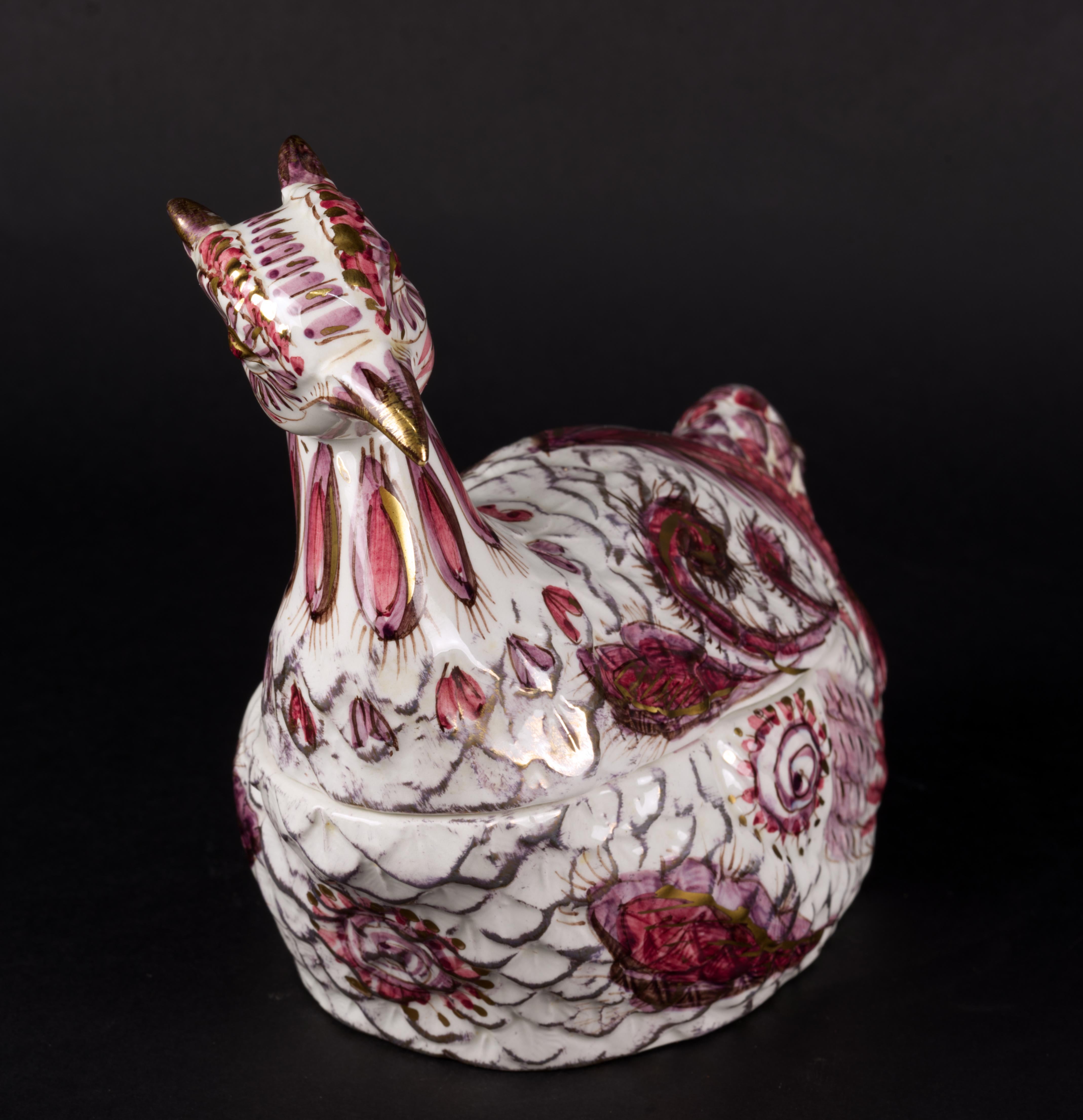  Vintage pheasant tureen with tail ladle was made in Italy by Mancioli Company. The bowl with the lid on forms a shape of a pheasant; the ladle forms its tail. It is decorated in rustic style in pink and cranberry red on white body with elaborate
