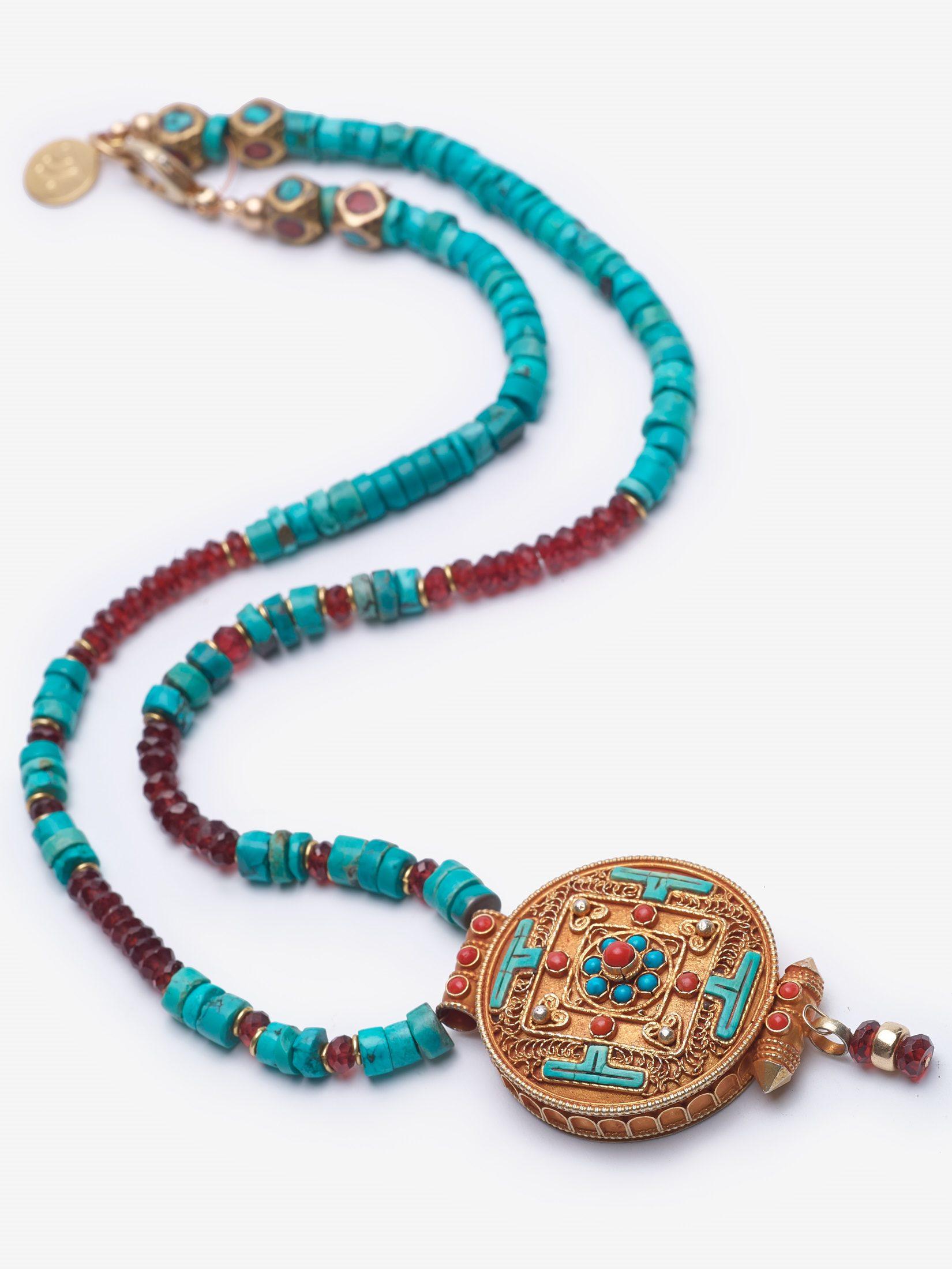 Mandalas represent the idea that life is never ending and have strong spiritual relevance. The Nepalese pendant is adorned with natural turquoise and coral. The statement necklace is comprised legendary stones, turquoise and garnet.