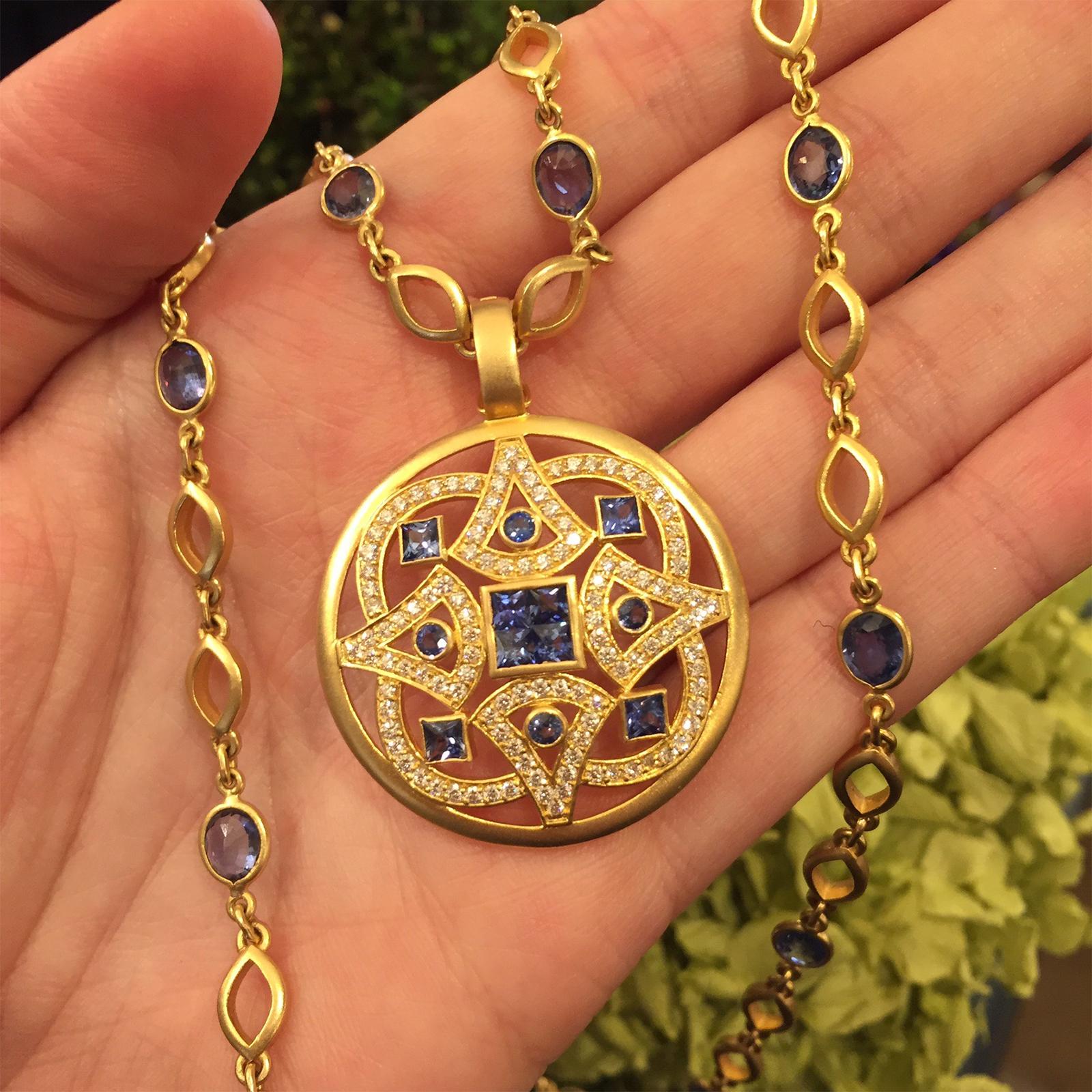 The Mandala is an ancient symbol which represents the circle of life.  Nancy offers several different versions of the Mandala, the one shown is set with 2cts. of Ceylon Blue Sapphires and 1.13cts Diamonds.
The pendant can be custom ordered in any